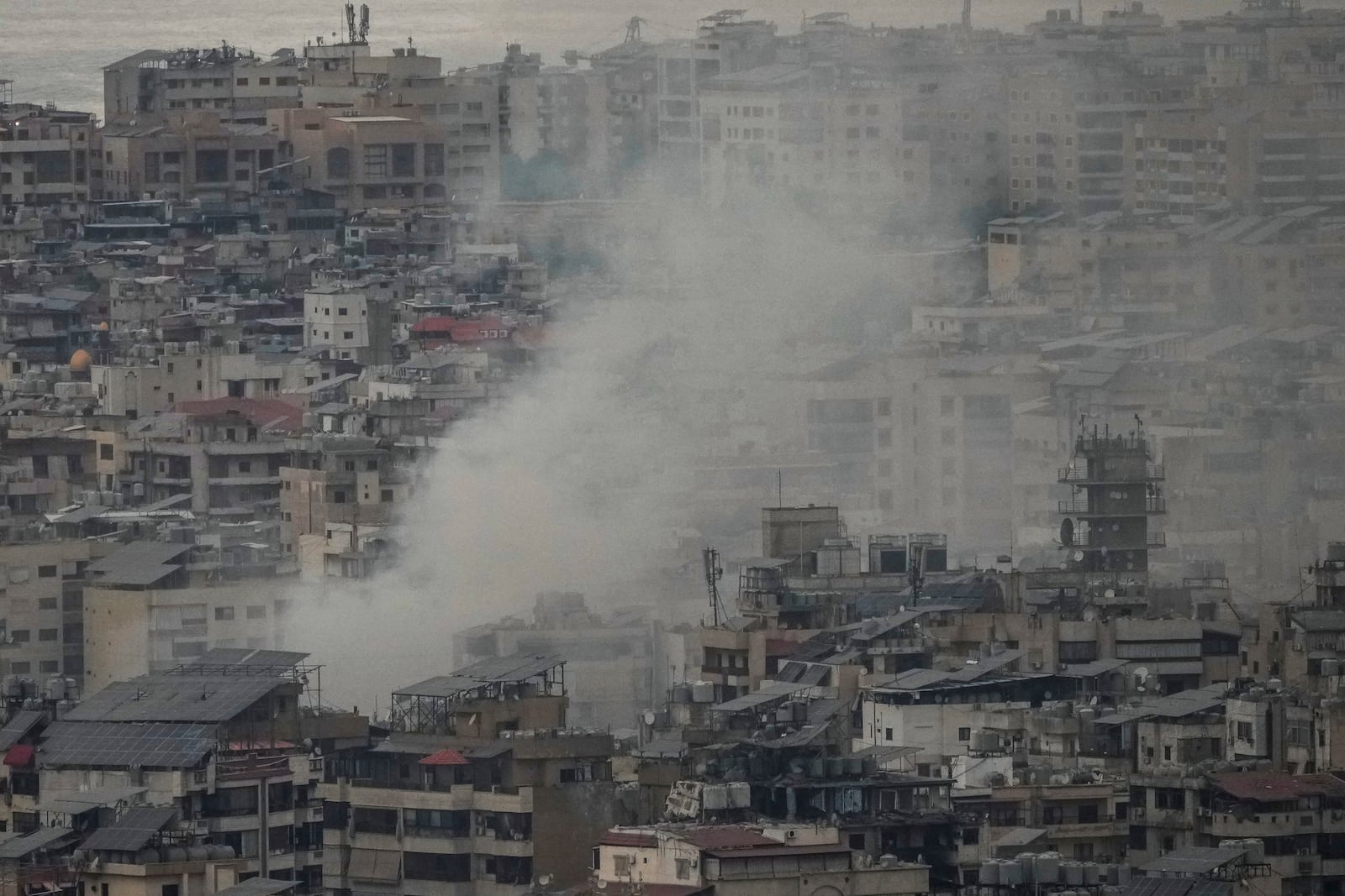 Smoke rises from an Israeli airstrike in Dahiyeh in Beirut, Lebanon, Thursday, Oct. 10, 2024. (AP Photo/Hassan Ammar)