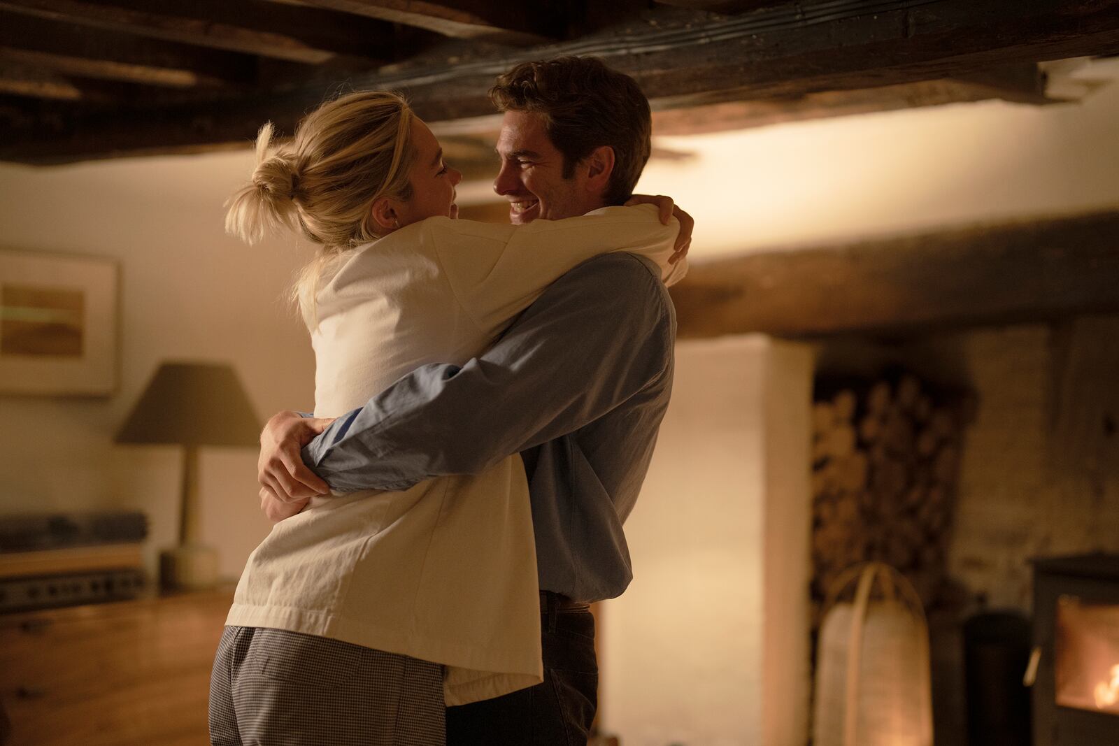 This image released by A24 shows Florence Pugh, left, and Andrew Garfield in a scene from "We Live In Time." (Peter Mountain/A24 via AP)