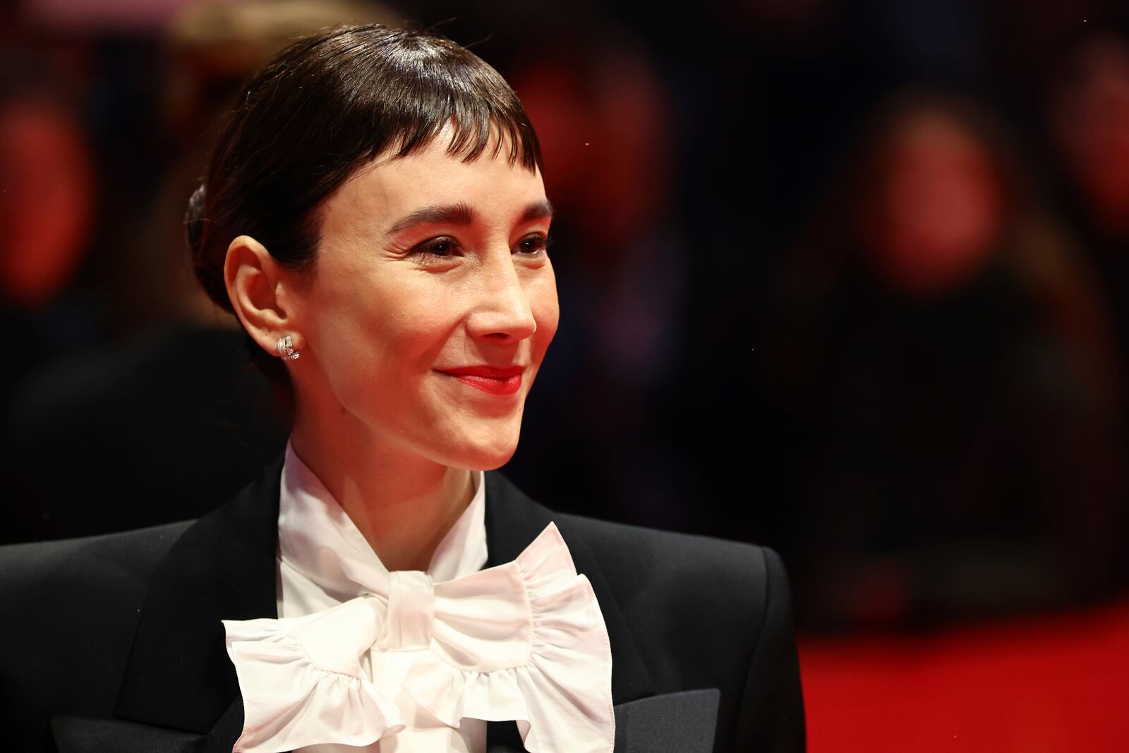 Actress Sibel Kekilli poses for photographers upon arrival at the opening of the International Film Festival, Berlinale, in Berlin, Thursday, Feb. 13, 2025. (Christoph Soeder/dpa via AP)