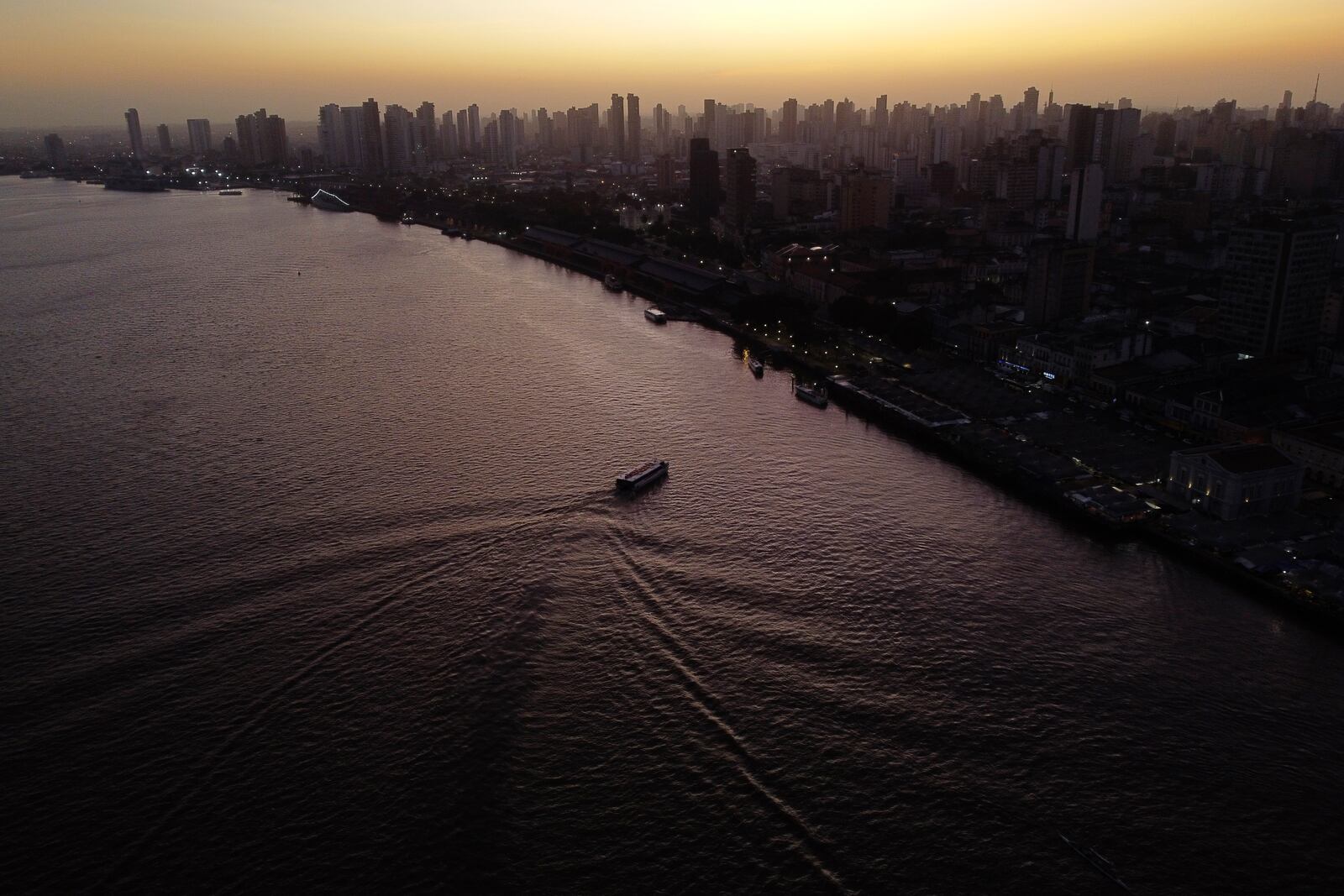 FILE - The sun rises over the bay of the Guama River in Belem, Brazil, Aug. 7, 2023. (AP Photo/Eraldo Peres, File)