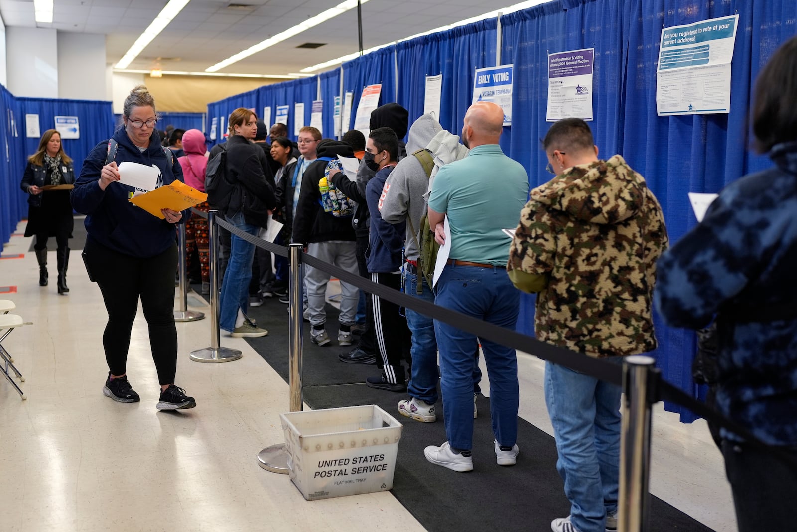 People line up to vote at the Chicago Early Voting Loop Supersite in Chicago, Thursday, Oct. 24, 2024. (AP Photo/Nam Y. Huh)