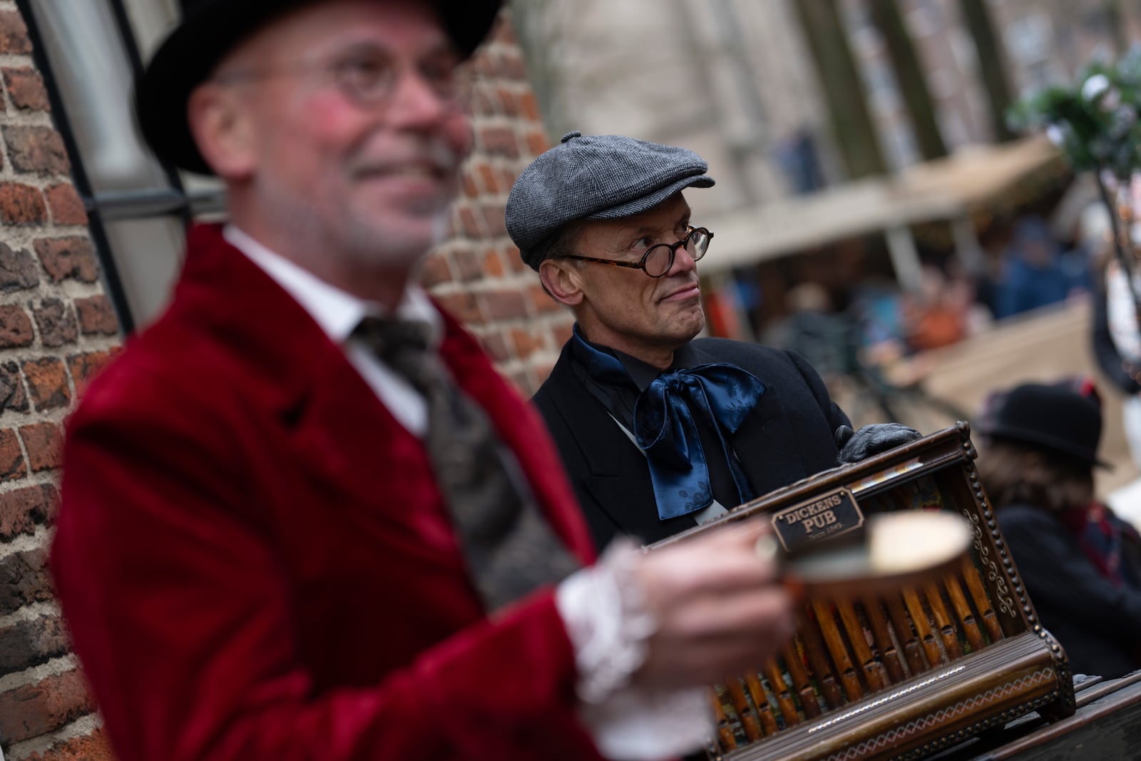 People in costumes from Charles Dickens' 19th-century English take part in a Dickens Festival, in Deventer, Netherlands, Saturday, Dec. 14, 2024. (AP Photo/Peter Dejong)