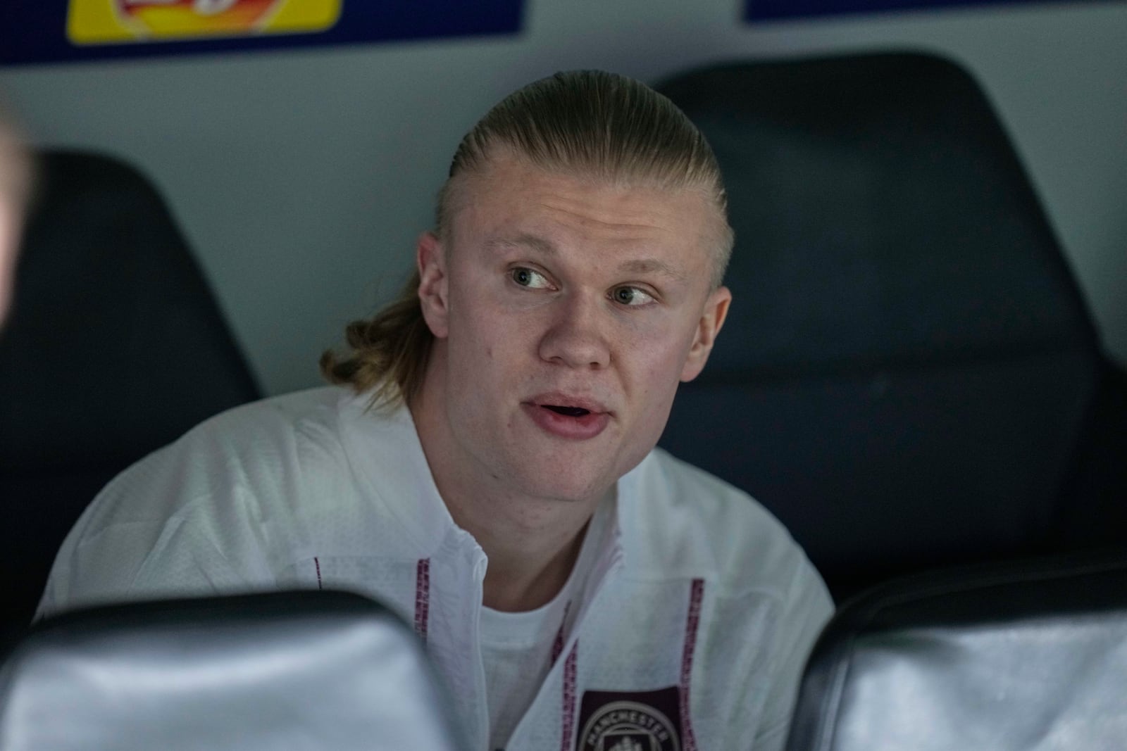 Manchester City's Erling Haaland sits on the bench ahead of the Champions League playoff second leg soccer match between Real Madrid and Manchester City at the Santiago Bernabeu Stadium in Madrid, Spain, Wednesday, Feb. 19, 2025. (AP Photo/Bernat Armangue)