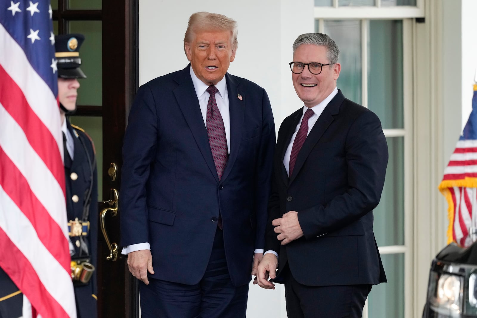 Britain's Prime Minister Keir Starmer, right, is greeted by President Donald Trump as he arrives at the White House in Washington, Thursday, Feb. 27, 2025. (AP Photo/Ben Curtis)