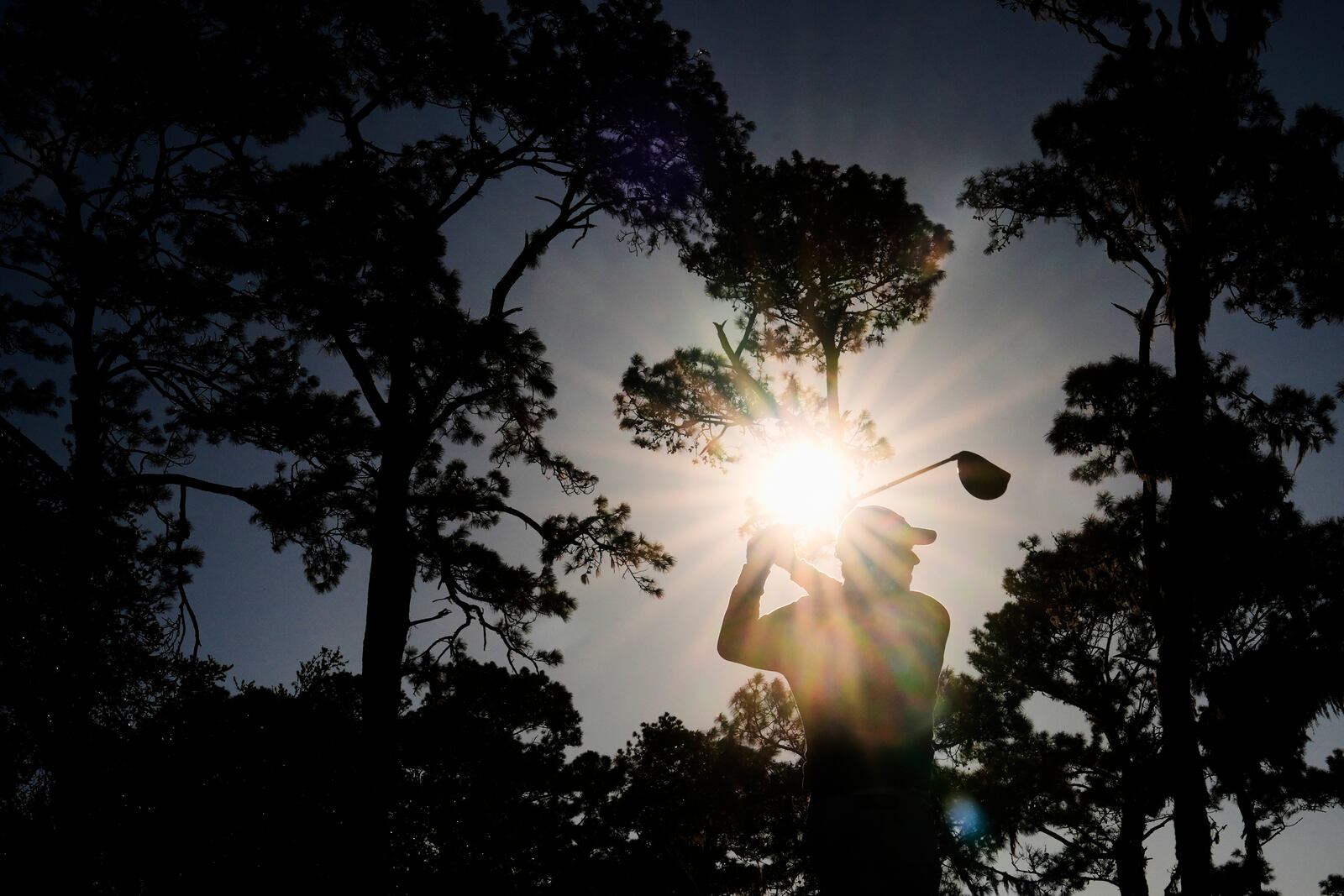 Rory McIlroy, of Northern Ireland, hits from the 16th tee during a playoff round of The Players Championship golf tournament Monday, March 17, 2025, in Ponte Vedra Beach, Fla. (AP Photo/Julia Demaree Nikhinson)