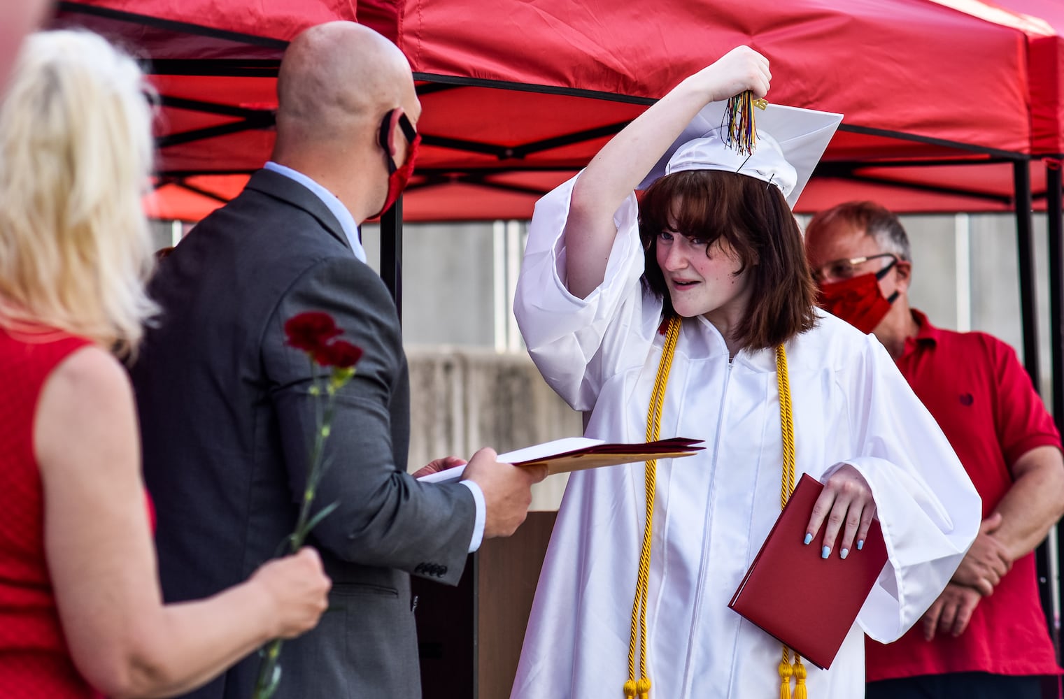 Madison High School drive-thru graduation ceremony at Land of Illusion