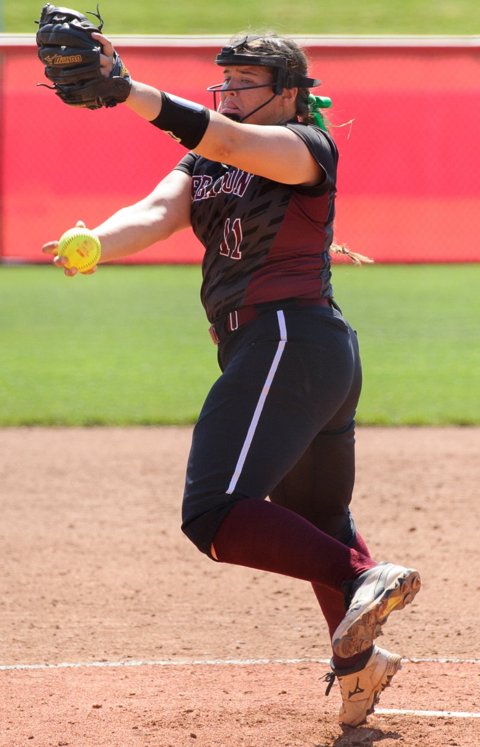 Lebanon starting pitcher Alexis Strother winds up to make a delivery Saturday during the Division I state final against Elyria at Firestone Stadium in Akron. CONTRIBUTED PHOTO BY BRYANT BILLING