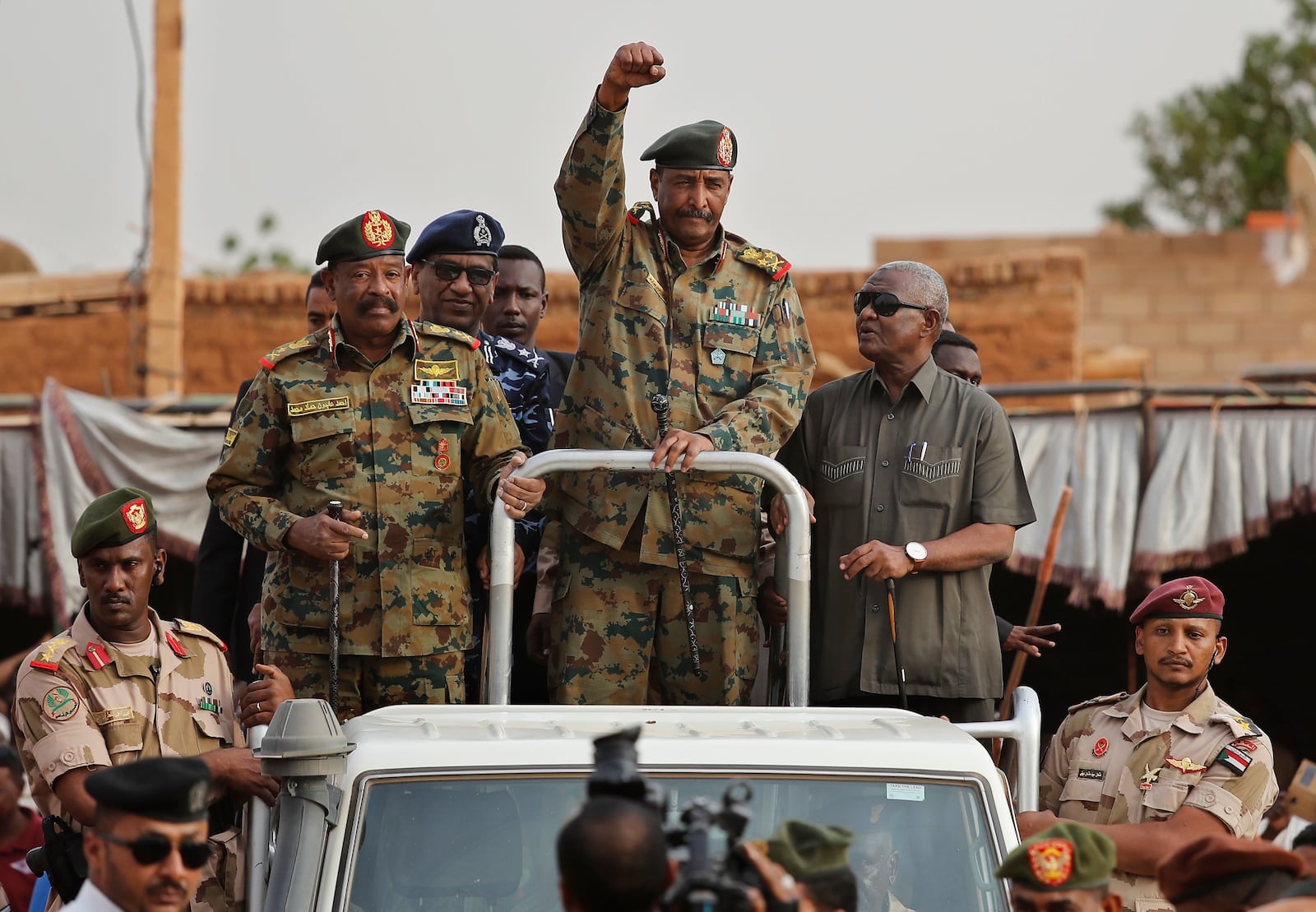 FILE - Sudanese Gen. Abdel-Fattah Burhan, head of the military council, waves to supporters upon his arrival to attend a military-backed rally, in Omdurman district, west of Khartoum, Sudan, on June 29, 2019. (AP Photo/Hussein Malla, File)