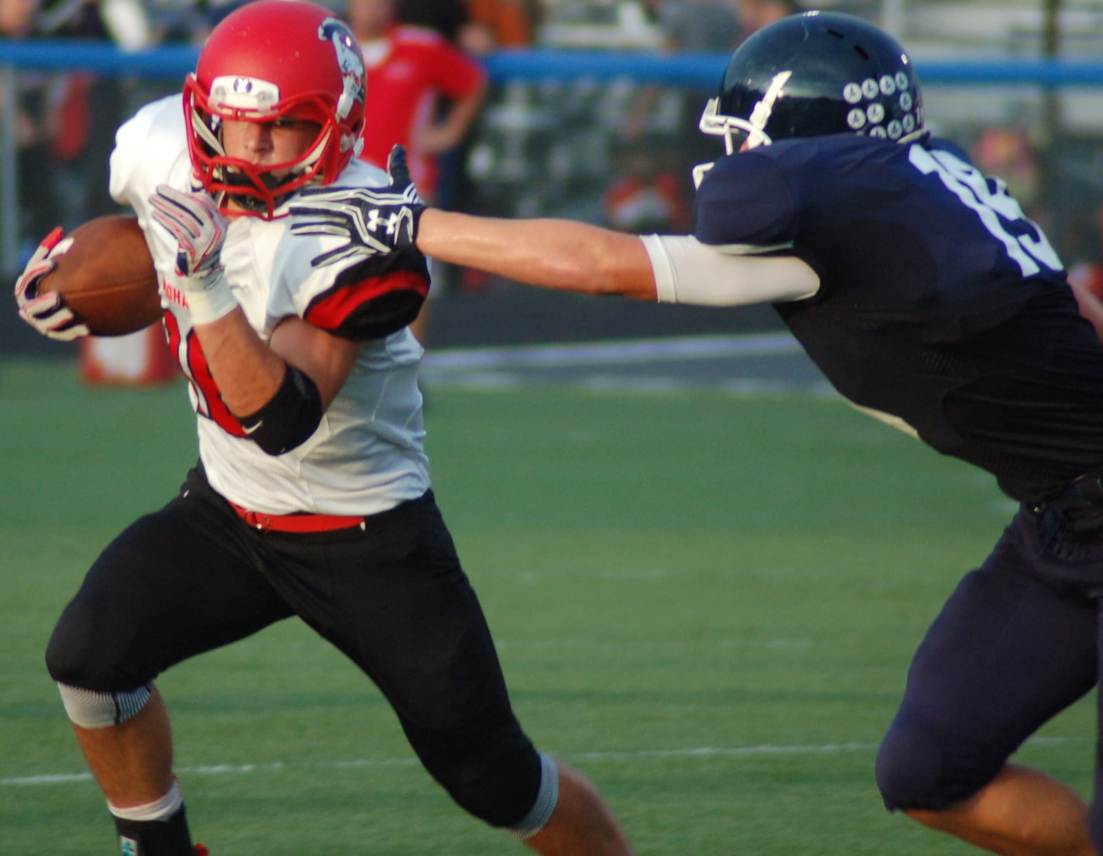 Madison’s Tyler Baumgartner tries to turn the corner on Valley View’s Sam Whisman at Barker Field in Germantown on Sept. 9. CONTRIBUTED PHOTO BY JOHN CUMMINGS