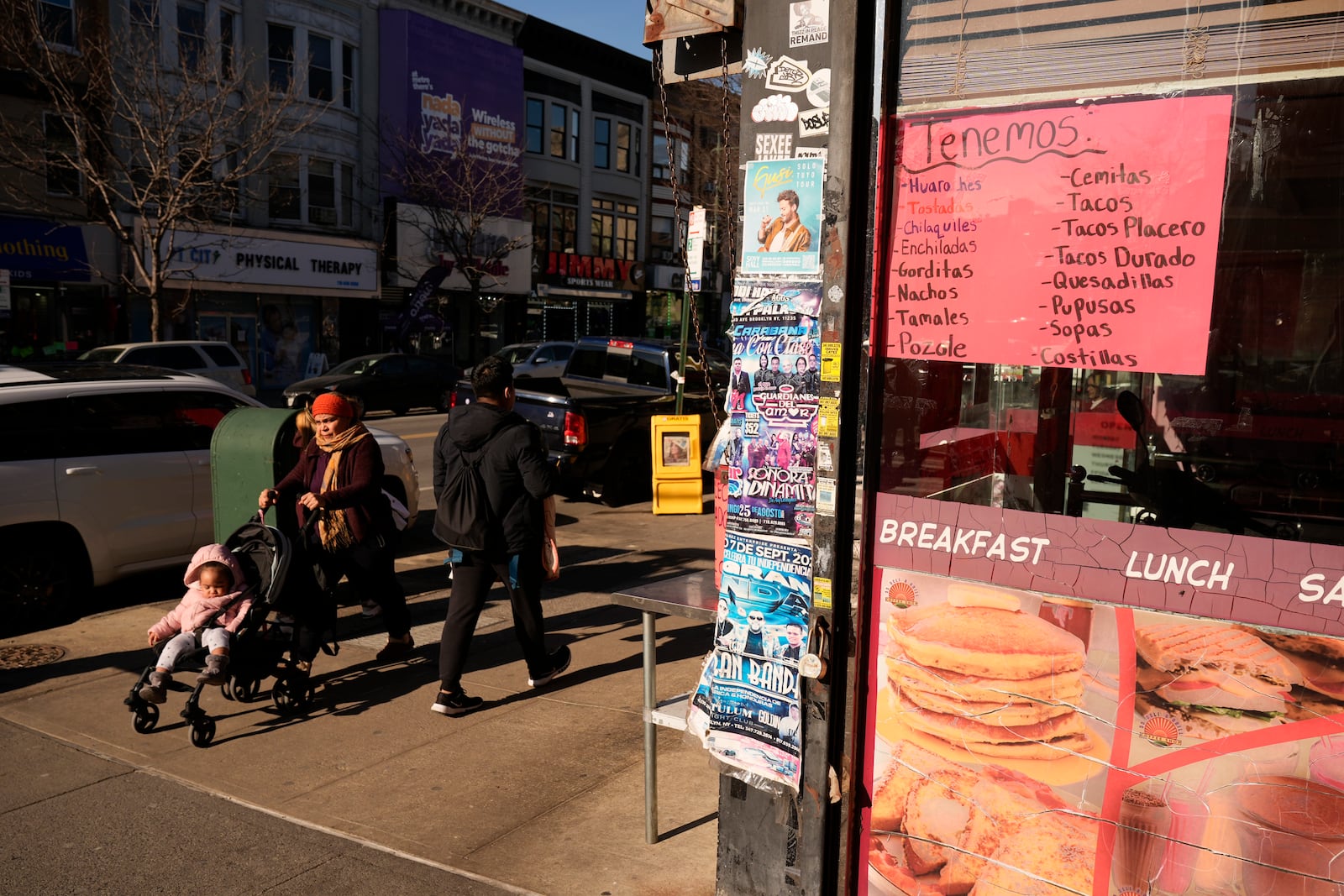 Signs in Spanish and English are displayed the Brooklyn borough of New York, Friday, Feb. 28, 2025. (AP Photo/Seth Wenig)