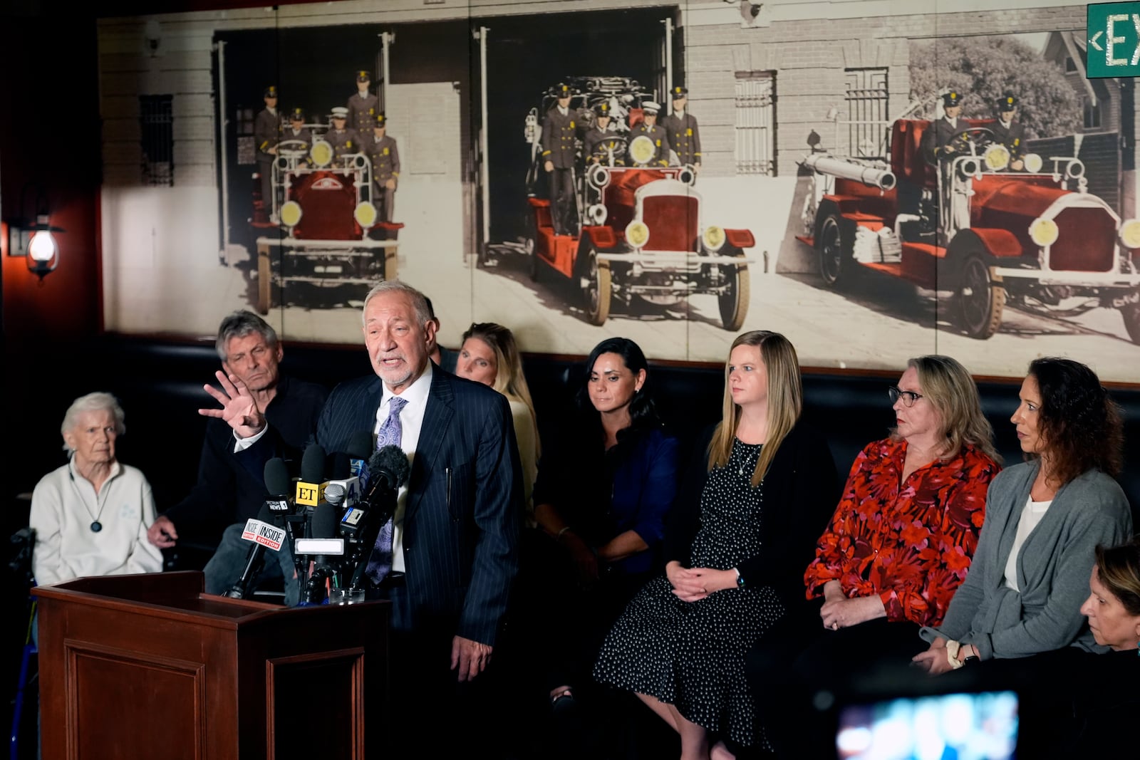 Mark Geragos defense attorney for Erik and Lyle Menendez surrounded by family members talks during a news conference on Thursday, Oct. 24, 2024, in Los Angeles. (AP Photo/Damian Dovarganes)