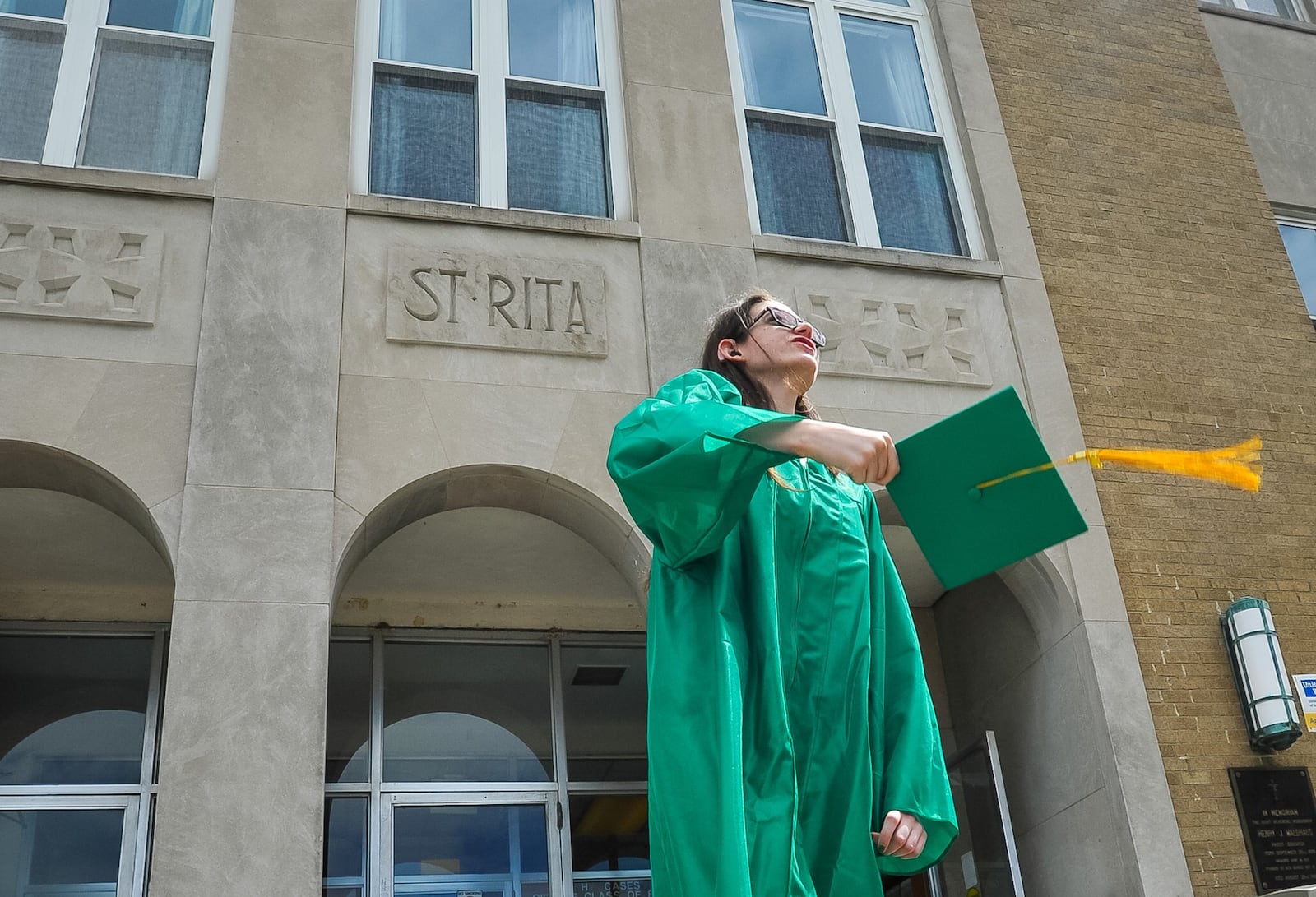 Tiffany Baker, of Hamilton, celebrates her graduation day May 29 at St. Rita School for the Deaf in Cincinnati. Baker, 19, was the only graduate this year. The last time St. Rita had that few graduates was its first graduating class in 1920. NICK GRAHAM/STAFF