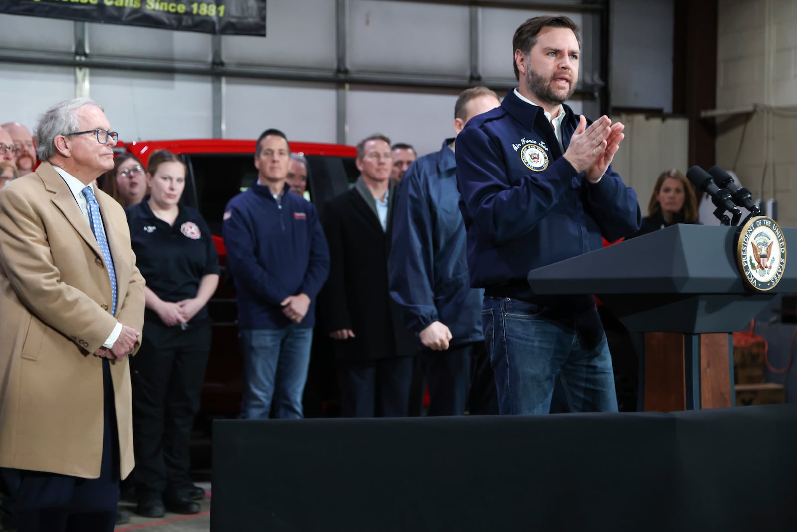 Ohio Gov. Mike DeWine, left, looks on as Vice President JD Vance speaks at the East Palestine Fire Department as he visits East Palestine, Ohio, Monday, Feb. 3, 2025. (Rebecca Droke/Pool Photo via AP)