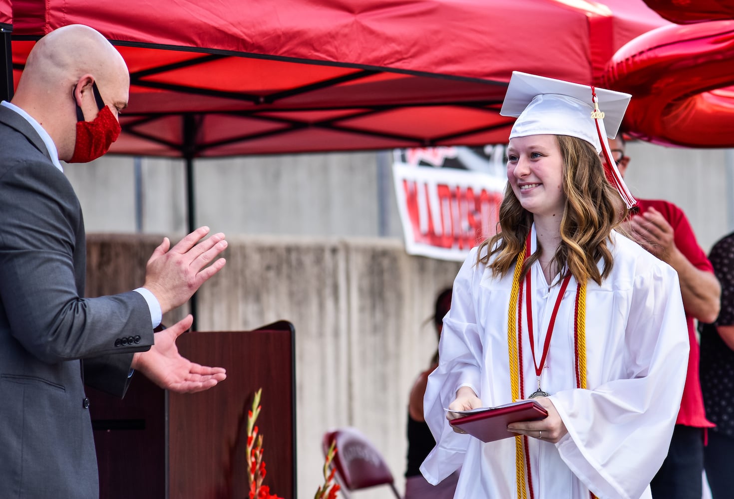 Madison High School drive-thru graduation ceremony at Land of Illusion