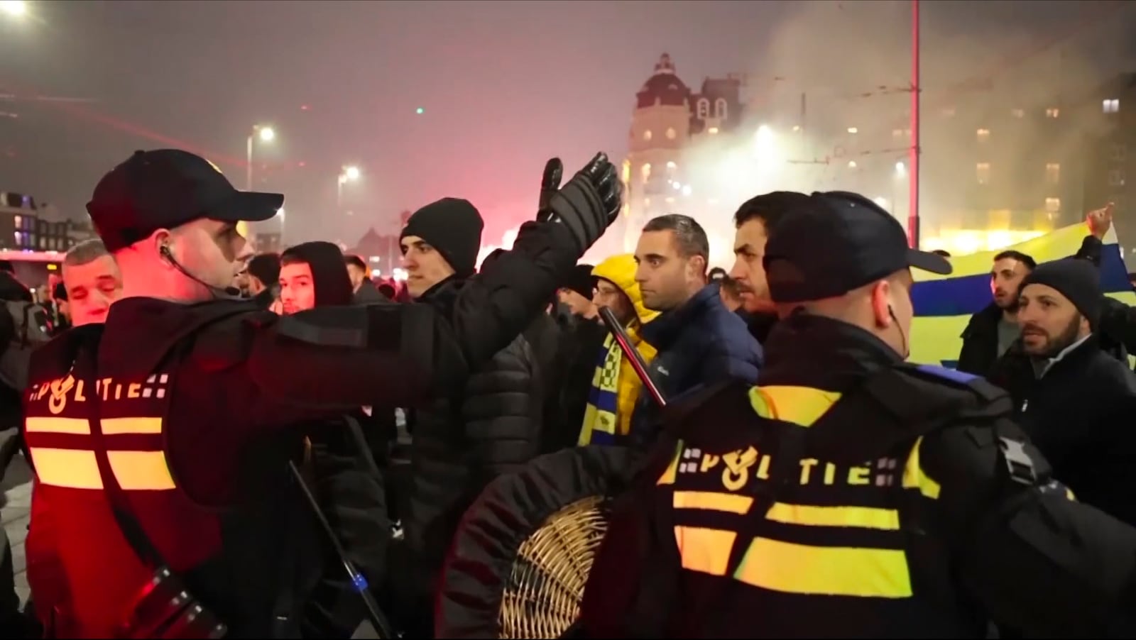 FILE - In this image taken from video, police escort Maccabi Tel Aviv supporters to the metro station leading them to the Ajax stadium, after pro-Palestinian supporters marched near the stadium, in Amsterdam, the Netherlands, Thursday, Nov. 7, 2024. (AP Photo InterVision, file)