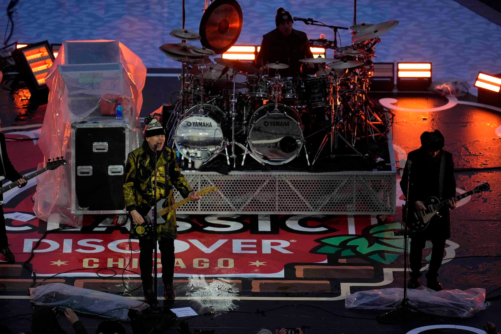 The Smashing Pumpkins perform before the NHL Winter Classic outdoor hockey game featuring the Chicago Blackhawks and St. Louis Blues at Wrigley Field, Tuesday, Dec. 31, 2024, in Chicago. (AP Photo/Erin Hooley)