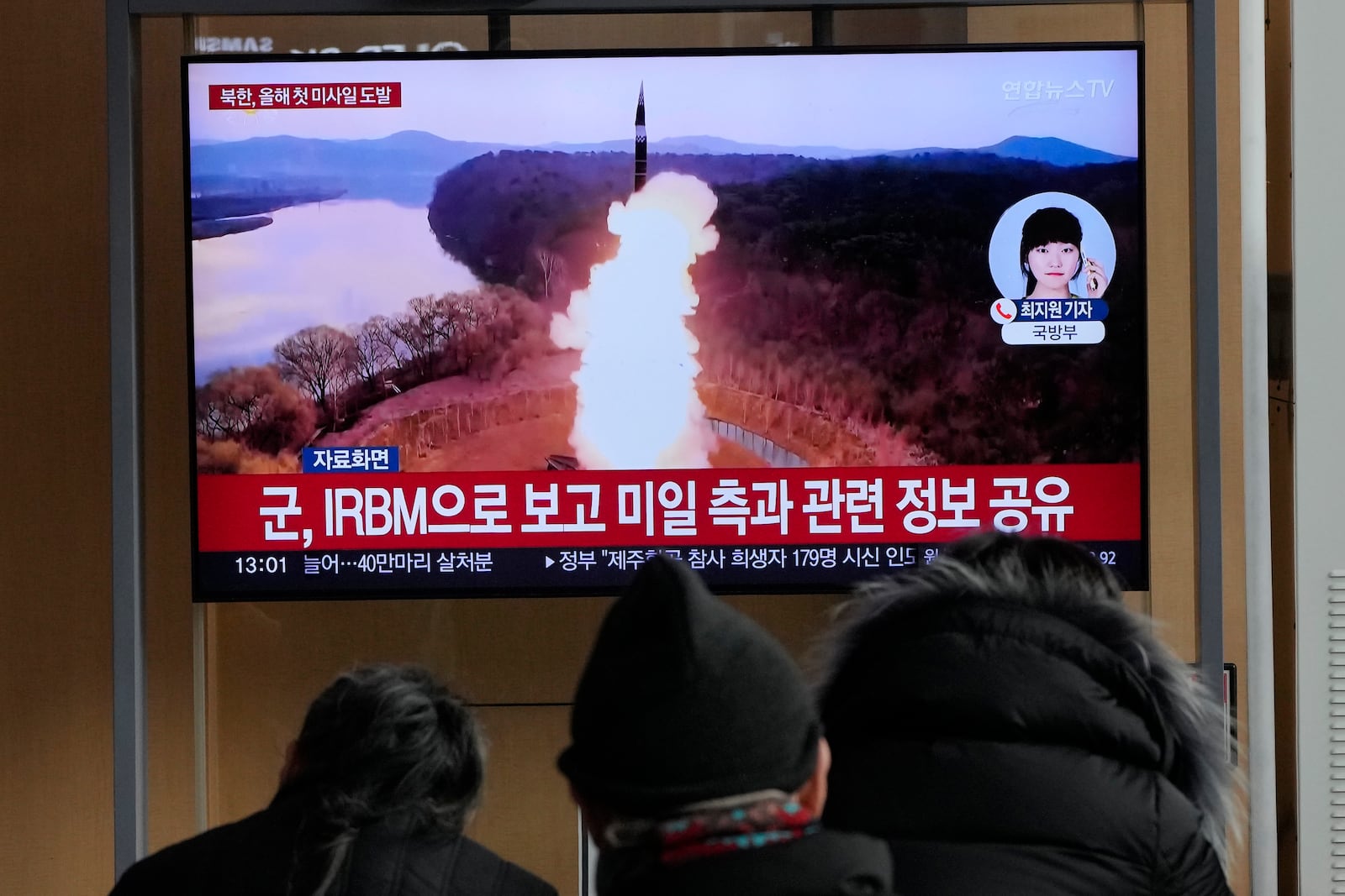 A TV screen shows a file image of North Korea's missile launch during a news program at Seoul Railway Station in Seoul, South Korea, Monday, Jan. 6, 2025. (AP Photo/Ahn Young-joon)