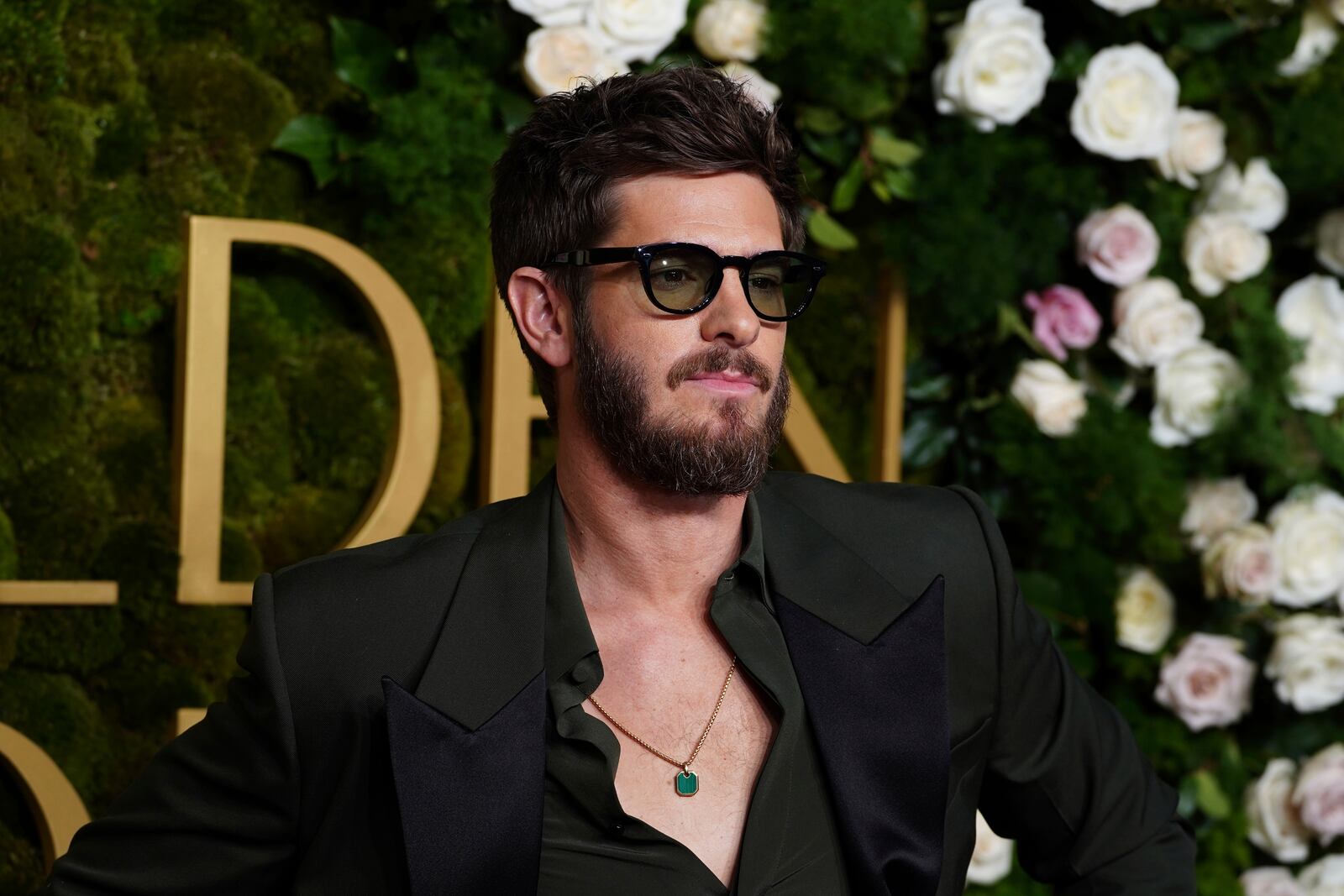 Andrew Garfield arrives at the 82nd Golden Globes on Sunday, Jan. 5, 2025, at the Beverly Hilton in Beverly Hills, Calif. (Photo by Jordan Strauss/Invision/AP)