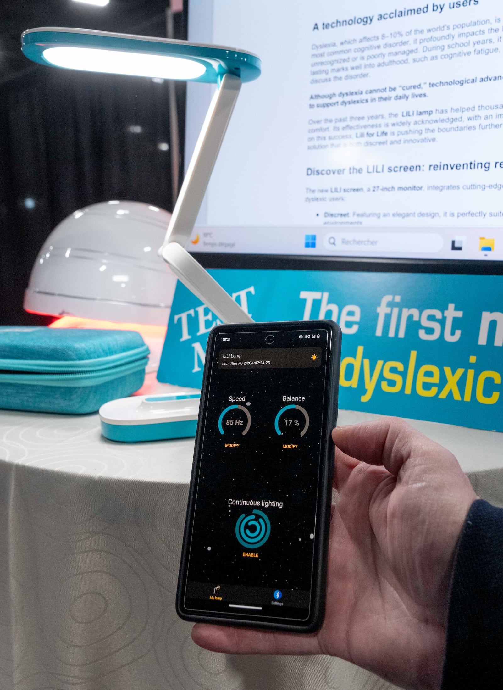 Lili showcases a reading light and monitor with adjustable frequency to help people with dyslexia during 2025 CES Unveiled, Sunday, Jan. 5, 2025, in Las Vegas. (Photo by Jack Dempsey)