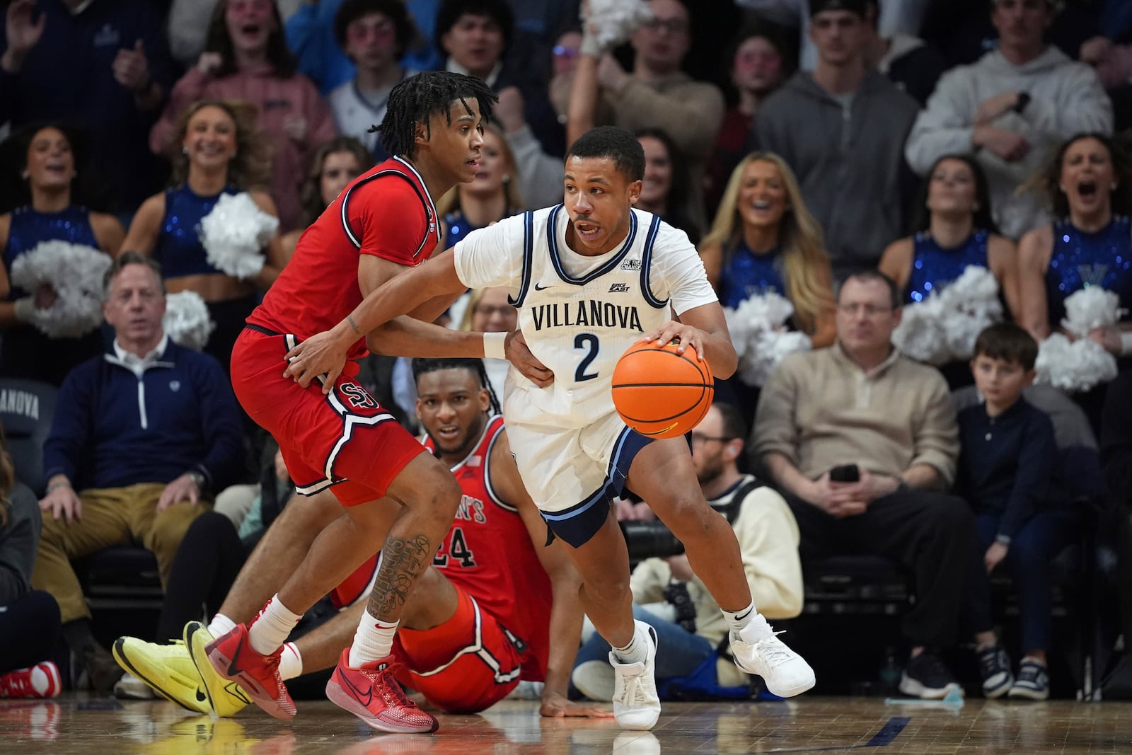 Villanova's Jhamir Brickus, right, tries to get past St. John's Simeon Wilcher during the second half of an NCAA college basketball game, Wednesday, Feb. 12, 2025, in Villanova, Pa. (AP Photo/Matt Slocum)