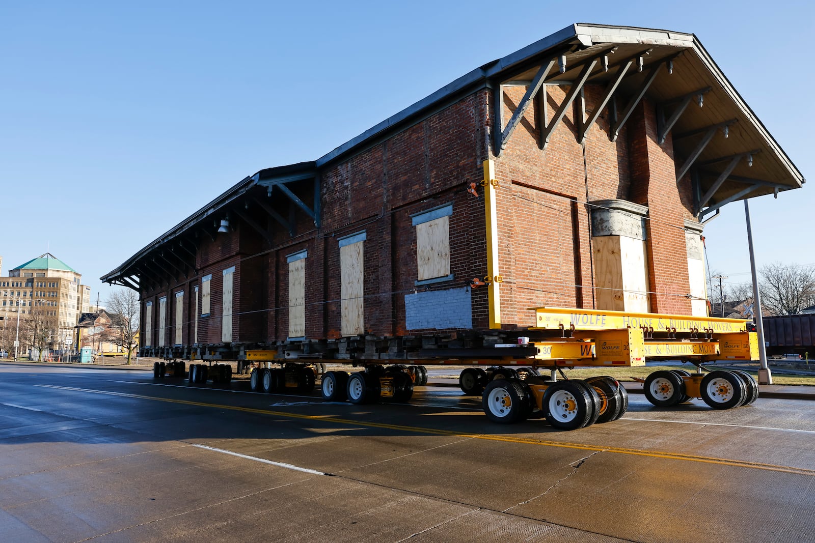 The second of two buildings that was once a train depot owned by CSX was moved by Wolfe House And Building Movers to its new location at the corner of Maple Avenue and MLK Jr. Boulevard Tuesday, Jan. 17, 2023 in Hamilton. The first building, a 220-ton two-story building, was moved in December. NICK GRAHAM/STAFF