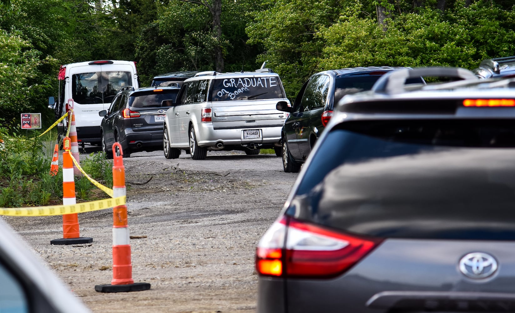 Madison High School drive-thru graduation ceremony at Land of Illusion