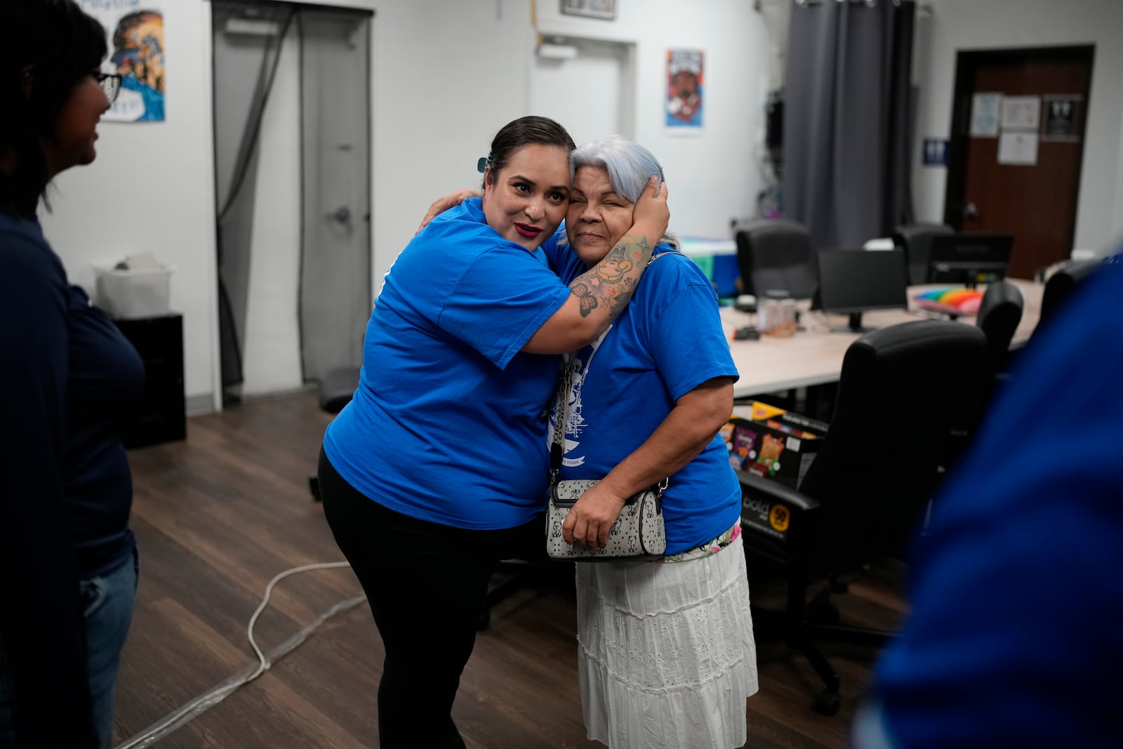 Erika Marquez, left, embraces Leticia Pinedo after a meeting at the nonprofit Make the Road Nevada, Thursday, Sept. 12, 2024, in Las Vegas. Marquez is a recipient of an Obama administration amnesty for immigrants brought to the U.S. illegally as children. (AP Photo/John Locher)