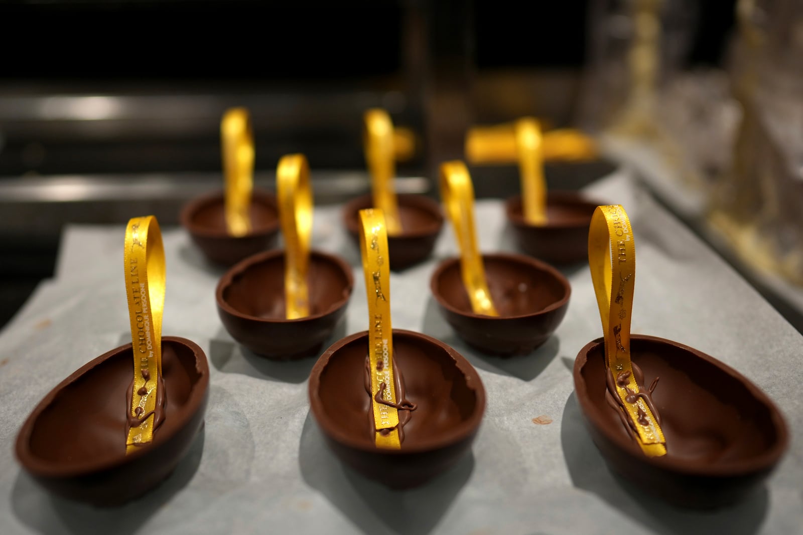 Chocolate eggs dry in the workshop at The Chocolate Line in Bruges, Belgium, Thursday, Feb. 6, 2025. (AP Photo/Virginia Mayo)