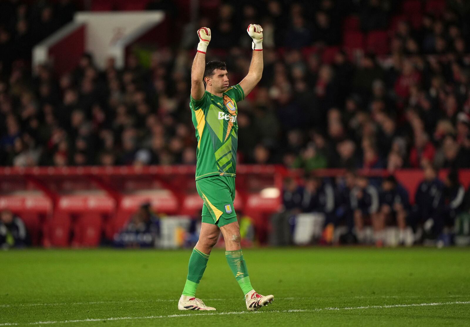 Aston Villa goalkeeper Emiliano Martinez celebrates after teammate Jhon Duran scores a goal against Nottingham Forest during a Premier League soccer match at the City Ground, Saturday Dec 14, 2024, in Nottingham, England. (Joe Giddens/PA via AP)