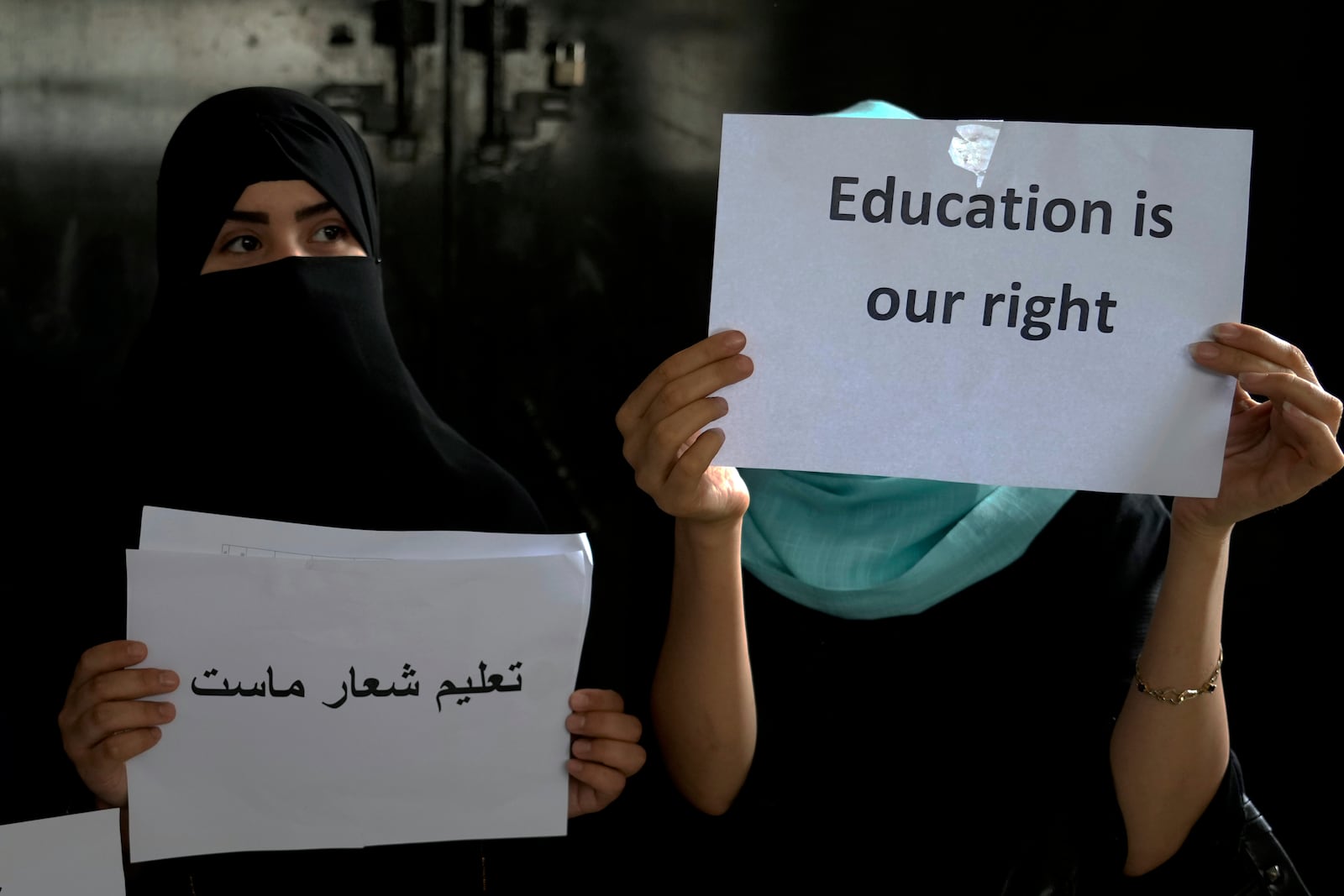 FILE -Afghan girls hold illegal protest to demand the right to education in a private home in Kabul, Afghanistan, Tuesday, Aug. 2, 2022. (AP Photo/Ebrahim Noroozi, File)