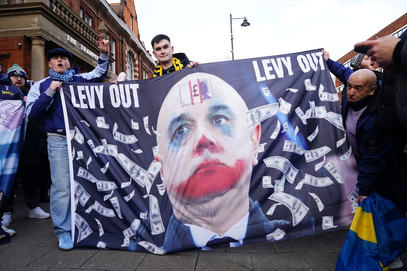 Tottenham Hotspur fans protest against the club owners ahead of the Premier League match between Tottenham and Manchester United at the Tottenham Hotspur Stadium, London, Sunday Feb. 16, 2025. (John Walton/PA via AP)