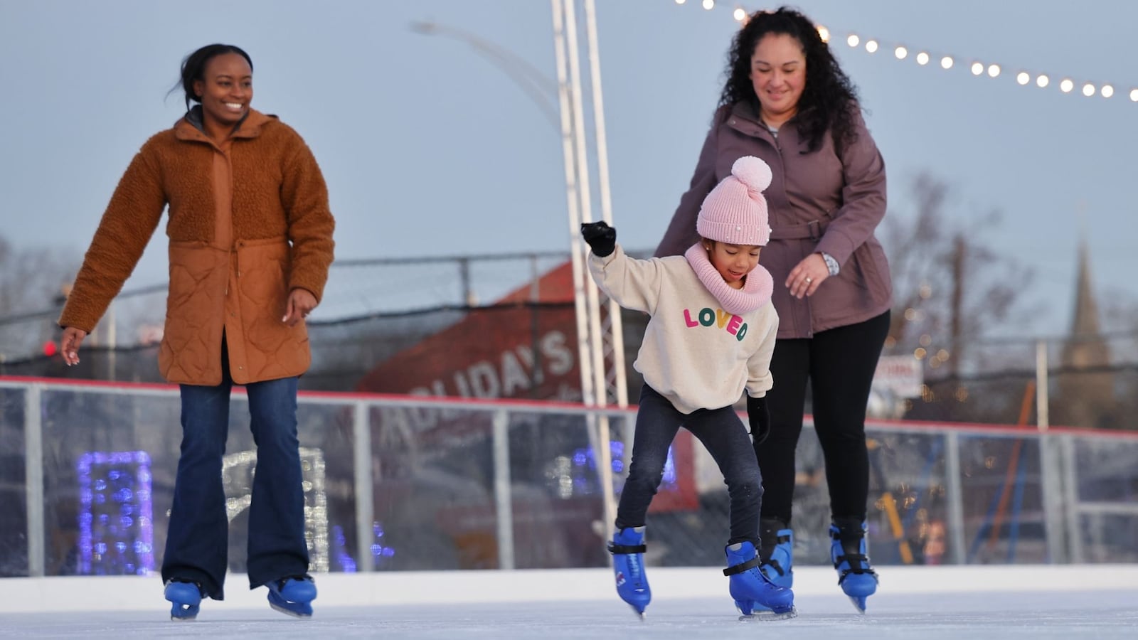 Corissa Johnson, 5, skates with her mom, Cristina Johnson, right, and aunt Kenisha Johnson at the Middletown Holiday Whopla ice skating rink Wednesday, Dec. 13, 2023 in downtown Middletown. NICK GRAHAM/STAFF