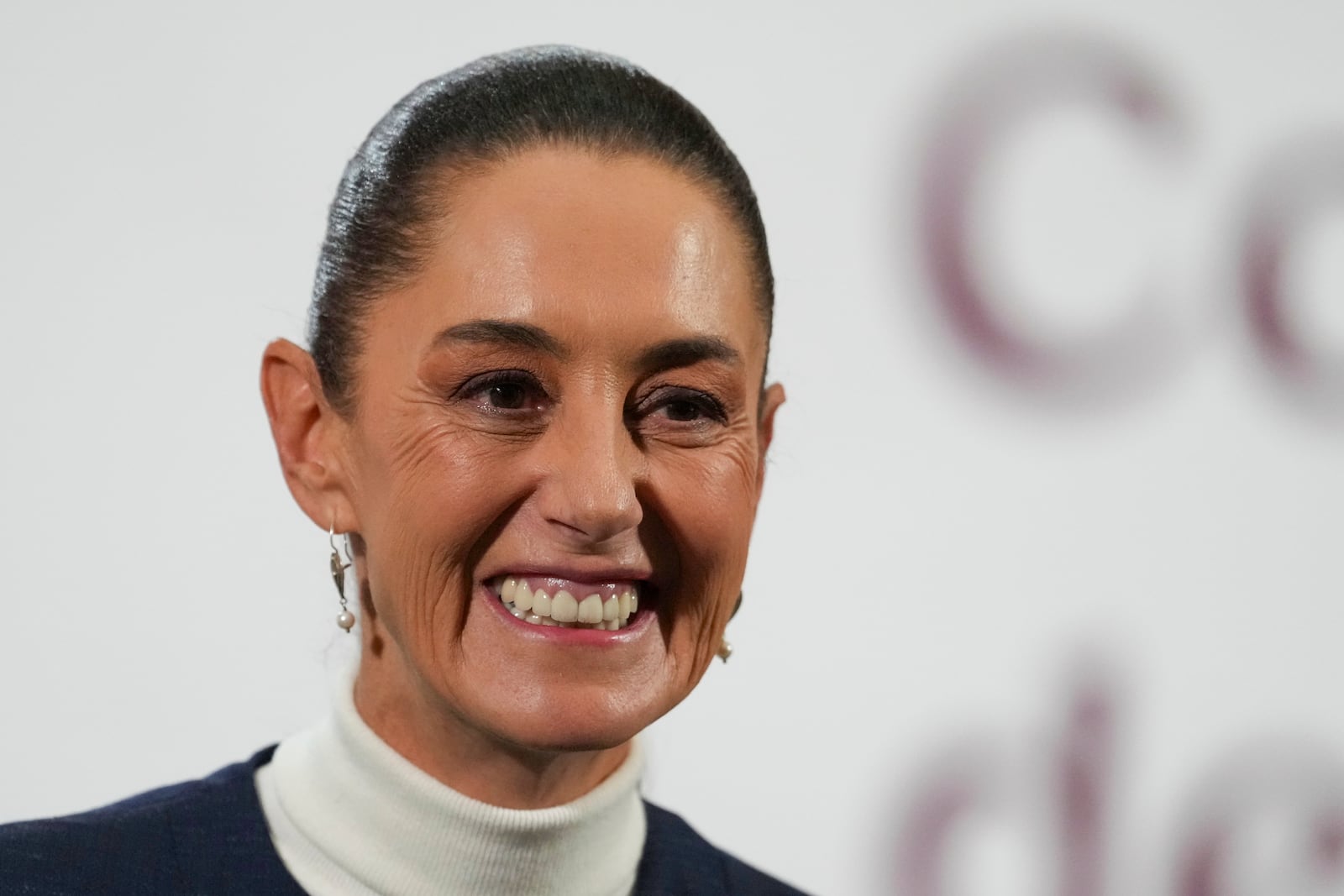 Mexican President Claudia Sheinbaum gives her morning news conference at the national palace in Mexico City, Monday, Feb. 3, 2025. (AP Photo/Marco Ugarte)