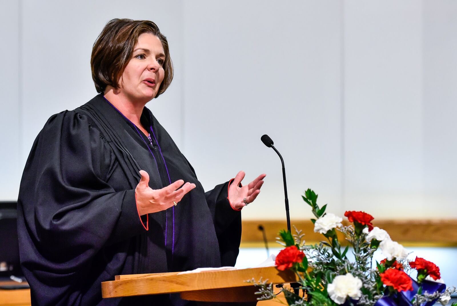 Melynda Cook Howard speaks to the crowd after she is sworn in as the next Middletown Municipal Court judge Friday, June 16 in Middletown City Council chambers. She succeeds the late Judge Mark Wall who died in February. Cook Howard will take the bench on Monday, June 19, but it’s only temporary unless she wins the November election to complete the remaining two years on Wall’s unexpired term. Cook Howard is one of four candidates in the race. NICK GRAHAM/STAFF