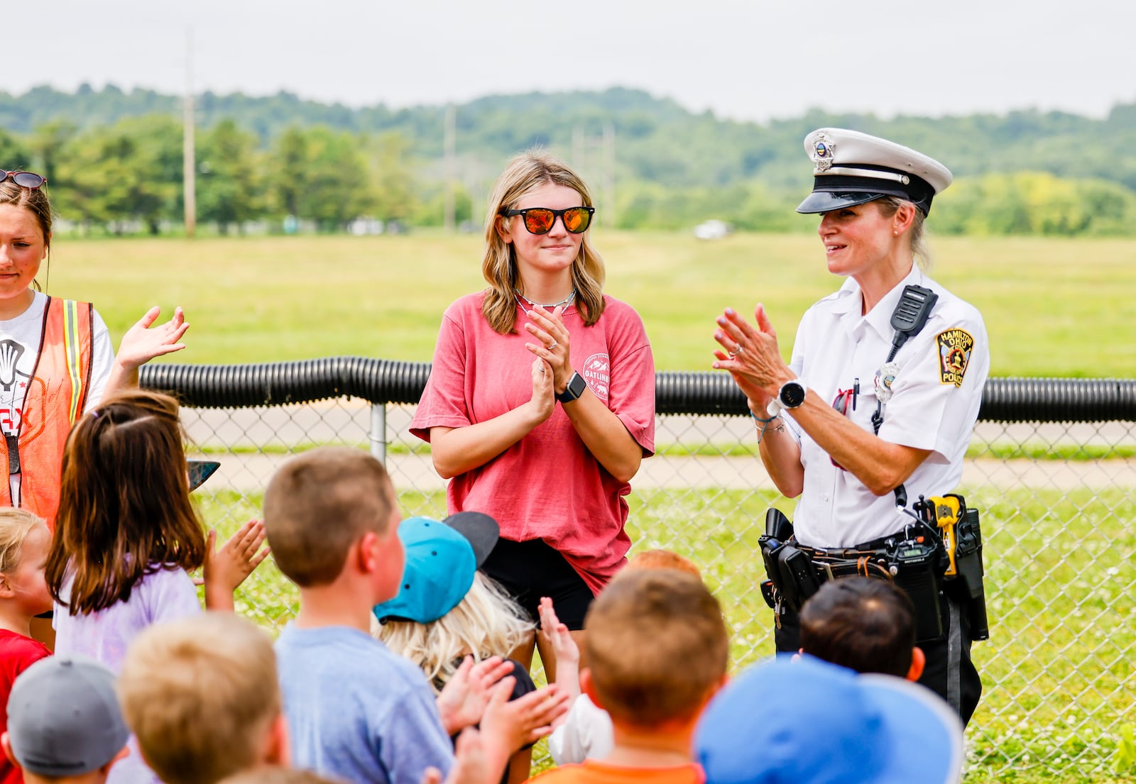 Hamilton Police officer Kristy Collins educates children during the 50th year of Safety Town Monday, June 13, 2022 at Office Bob Gentry Park in Hamilton. Four and five year old children are instructed in pedestrian, vehicle, bus, gun and fire safety. NICK GRAHAM/STAFF