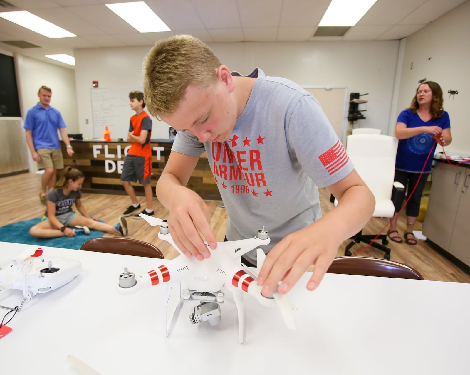 Conner Taylor, 13, of Carlisle Middle School, builds a drone during Drone Camp held at Butler Tech, Thursday, June 15, 2017. GREG LYNCH / STAFF