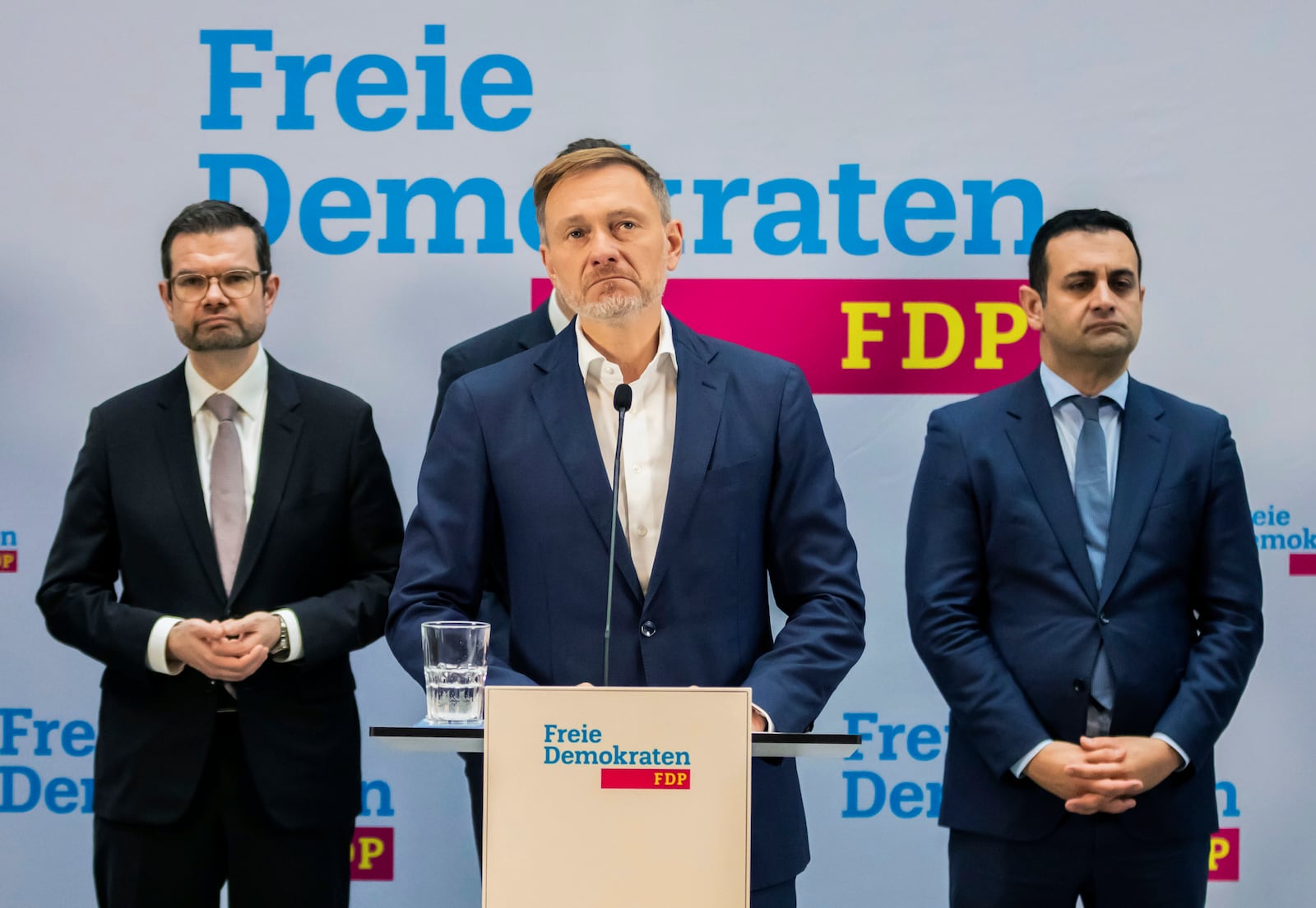 Christian Lindner, center, outgoing Federal Minister of Finance, speaks during a press conference at the FDP party headquarters, in Berlin, Thursday, Nov. 7, 2024. (Christoph Soeder/dpa via AP)