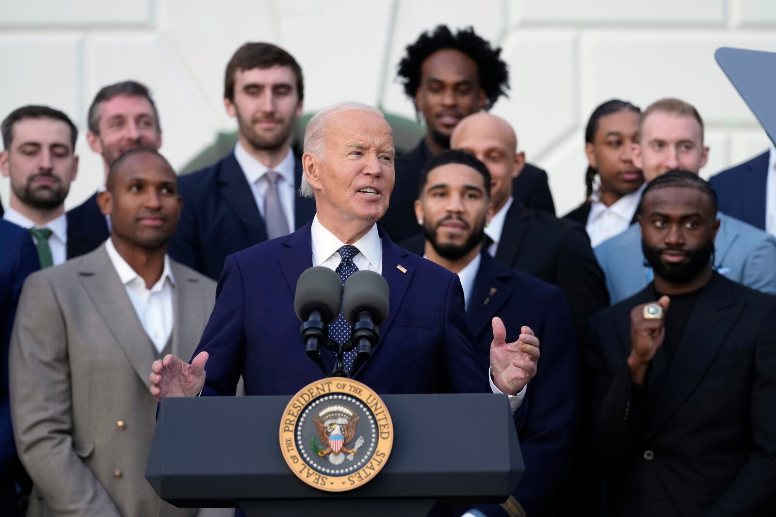 President Joe Biden, center, speaks during an event to welcome the Boston Celtics and celebrate their victory in the 2024 National Basketball Association Championship, on the South Lawn of the White House in Washington, Thursday, Nov. 21, 2024. (AP Photo/Susan Walsh)