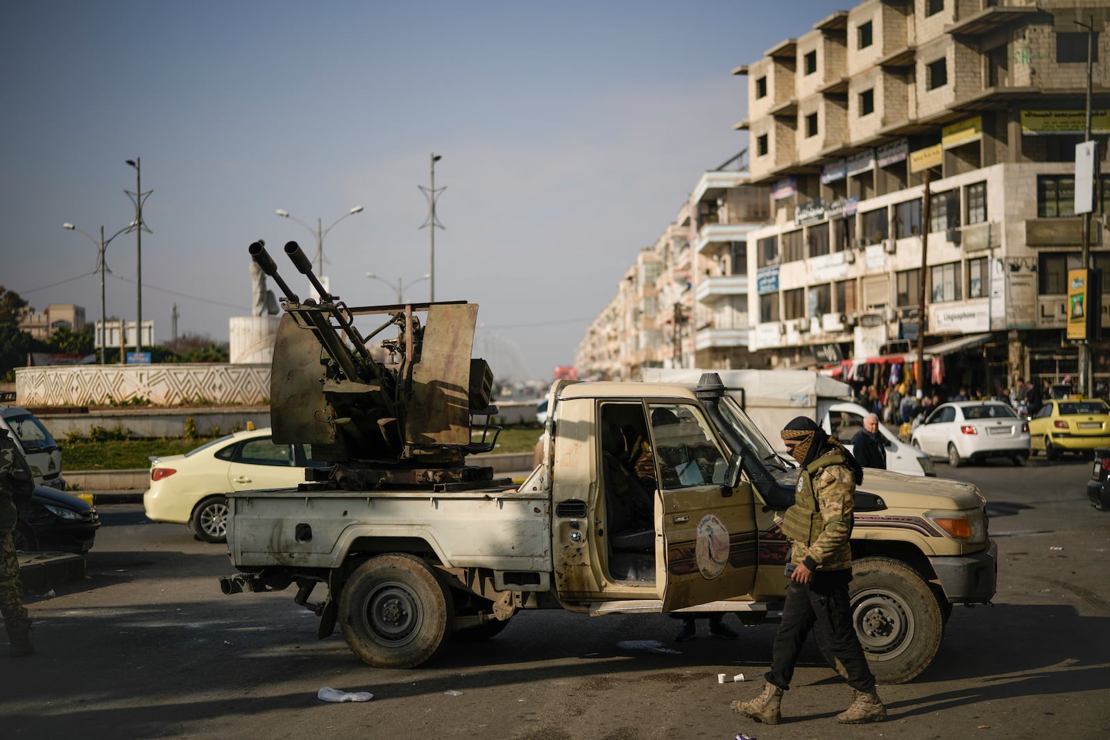 Security forces of the newly formed Syrian government patrol in downtown Homs, Syria, Thursday, Dec. 26, 2024. (AP Photo/Leo Correa)