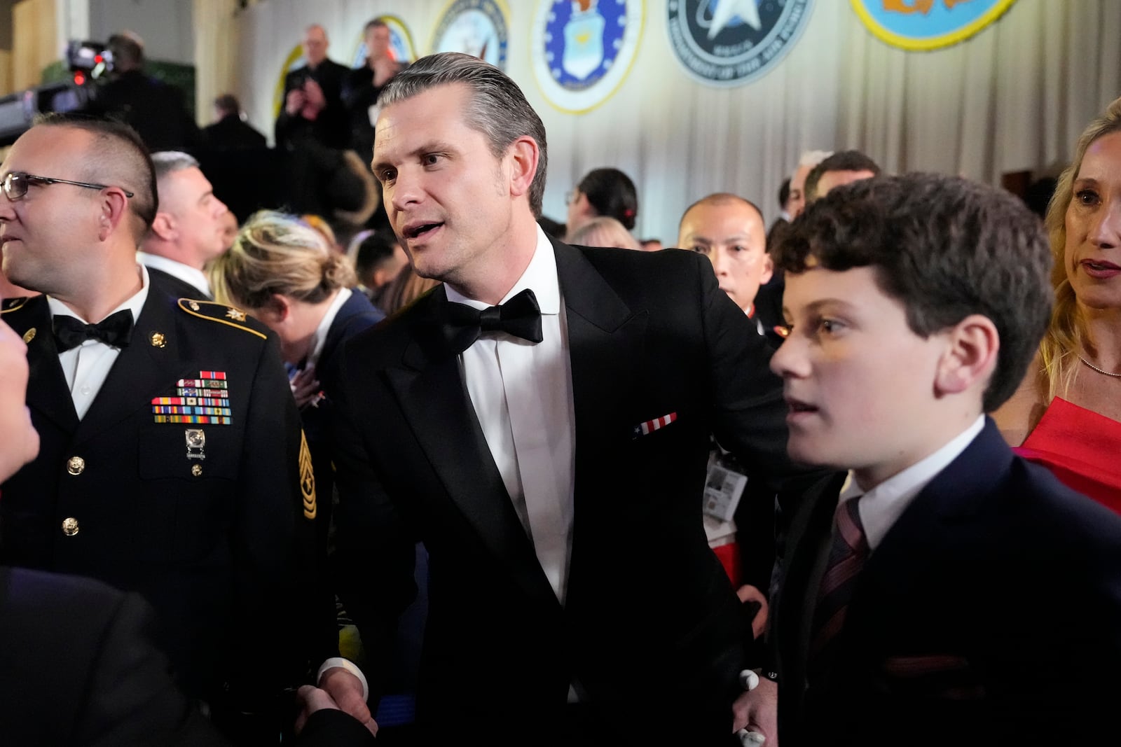 Defense Secretary nominee Pete Hegseth, center, attends the Commander in Chief Ball, Monday, Jan. 20, 2025, in Washington, after the 60th Presidential Inauguration. (AP Photo/Alex Brandon)