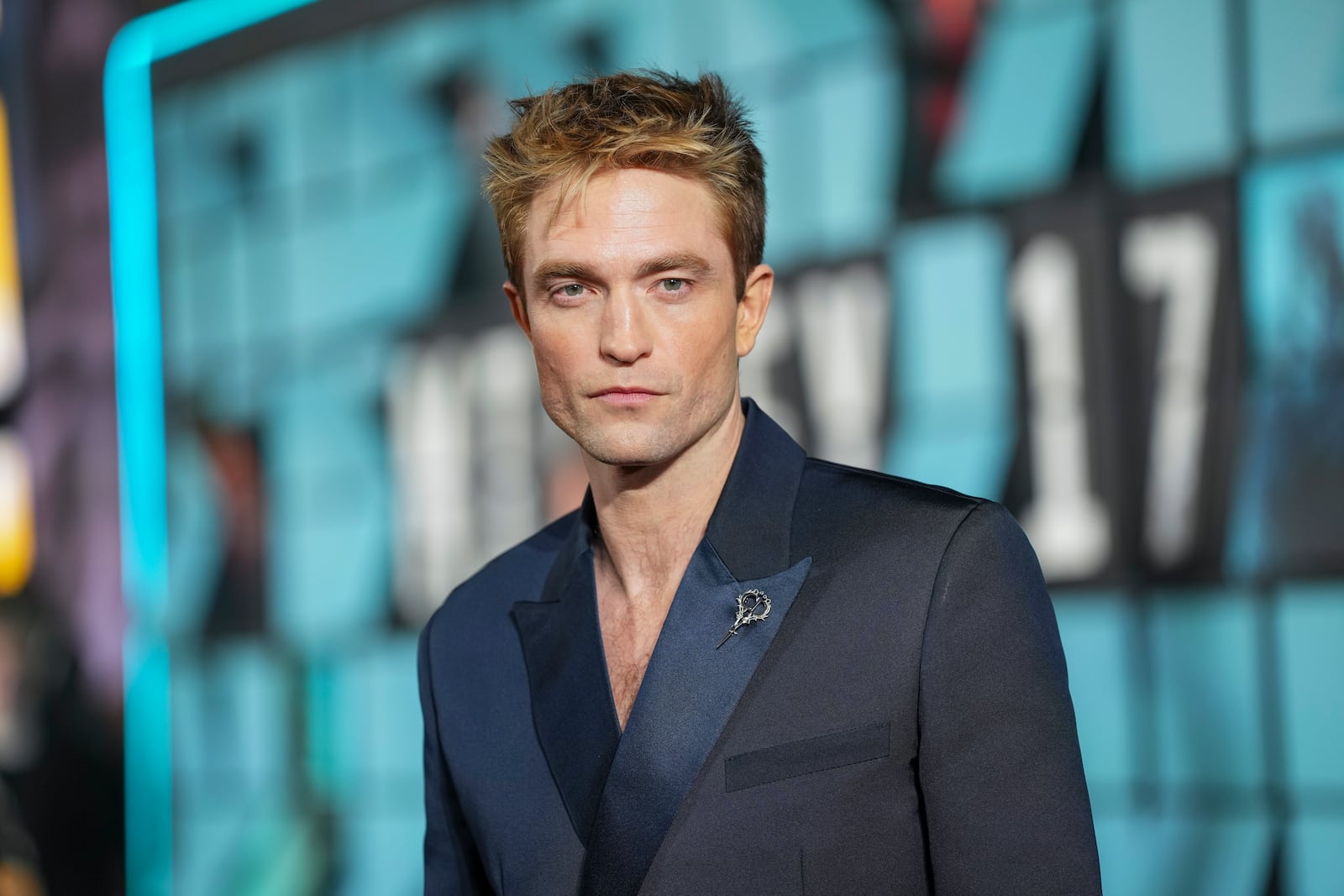 Robert Pattinson poses for photographers upon arrival at the World premiere for the film 'Mickey 17' on Thursday, Feb. 13, 2025, in London. (Photo by Scott A Garfitt/Invision/AP)