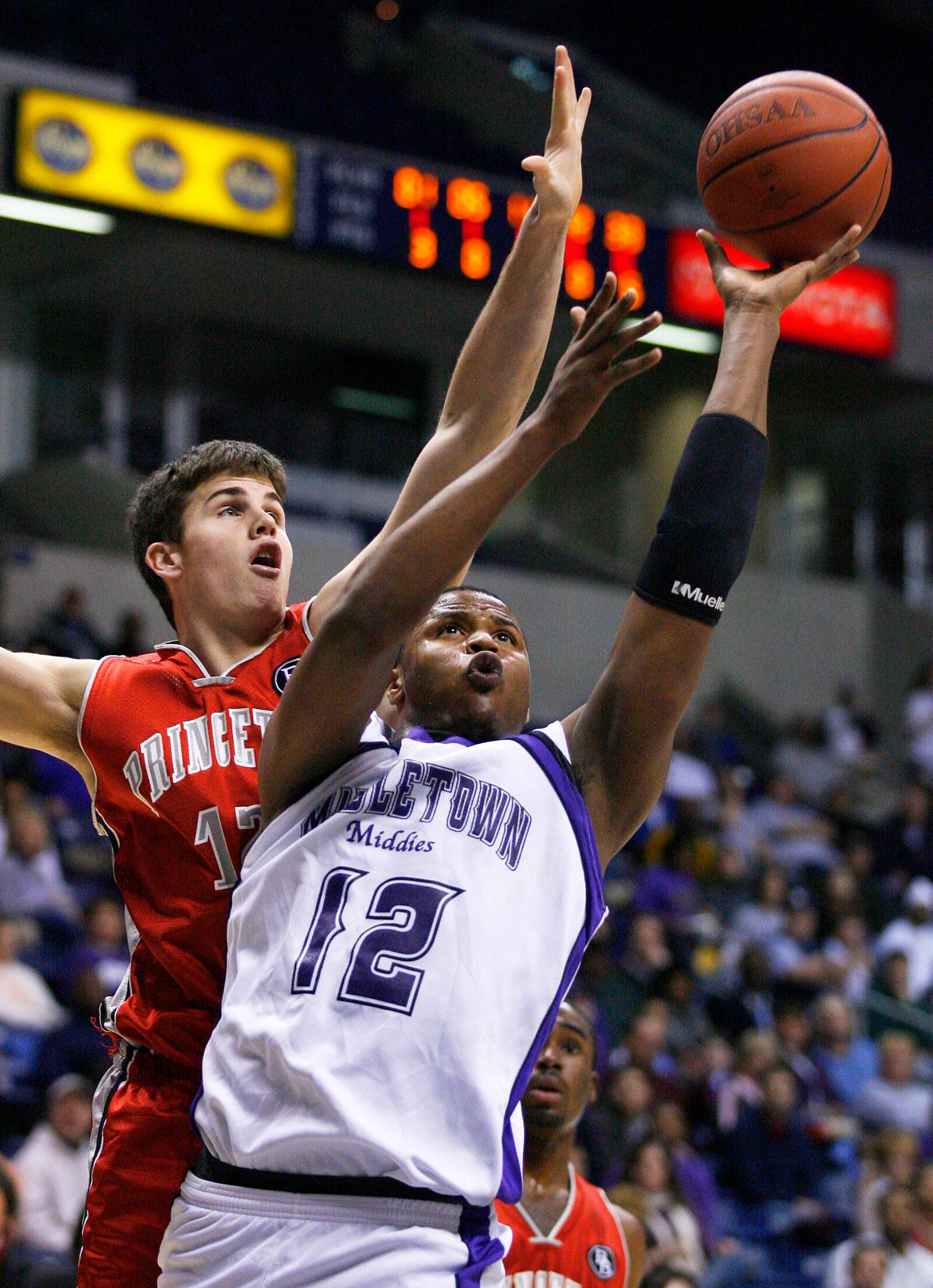 Princeton's Gregory Finger (CQ) tries to block a shot by Middletown's Bill Edwards, Jr. during the first half of their division I sectional finals game Sunday, February 24, 2008 at Xavier University's Cintas Center in Cincinnati, Ohio.Nick Graham/STAFF