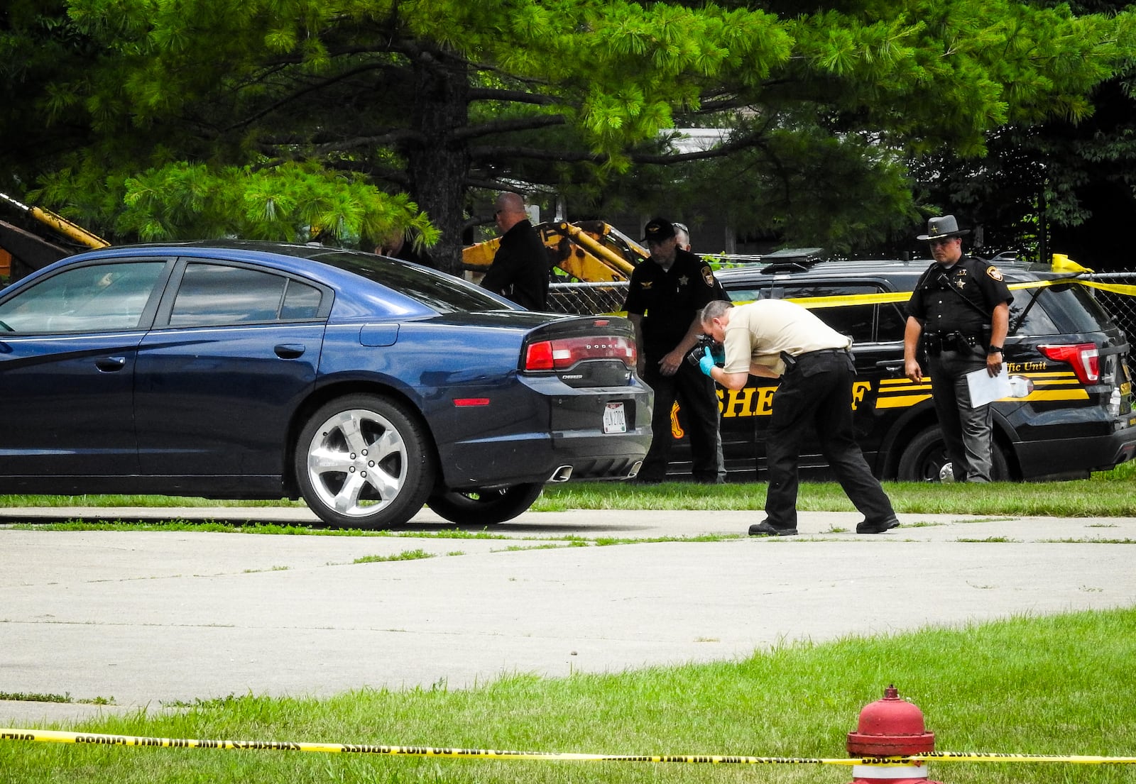 Police said they are processing three crime scenes after a double homicide: a stretch of road along Woodsdale Road; the Sal Boulevard apartment; and a car that was parked outside the Sal Boulevard apartment.