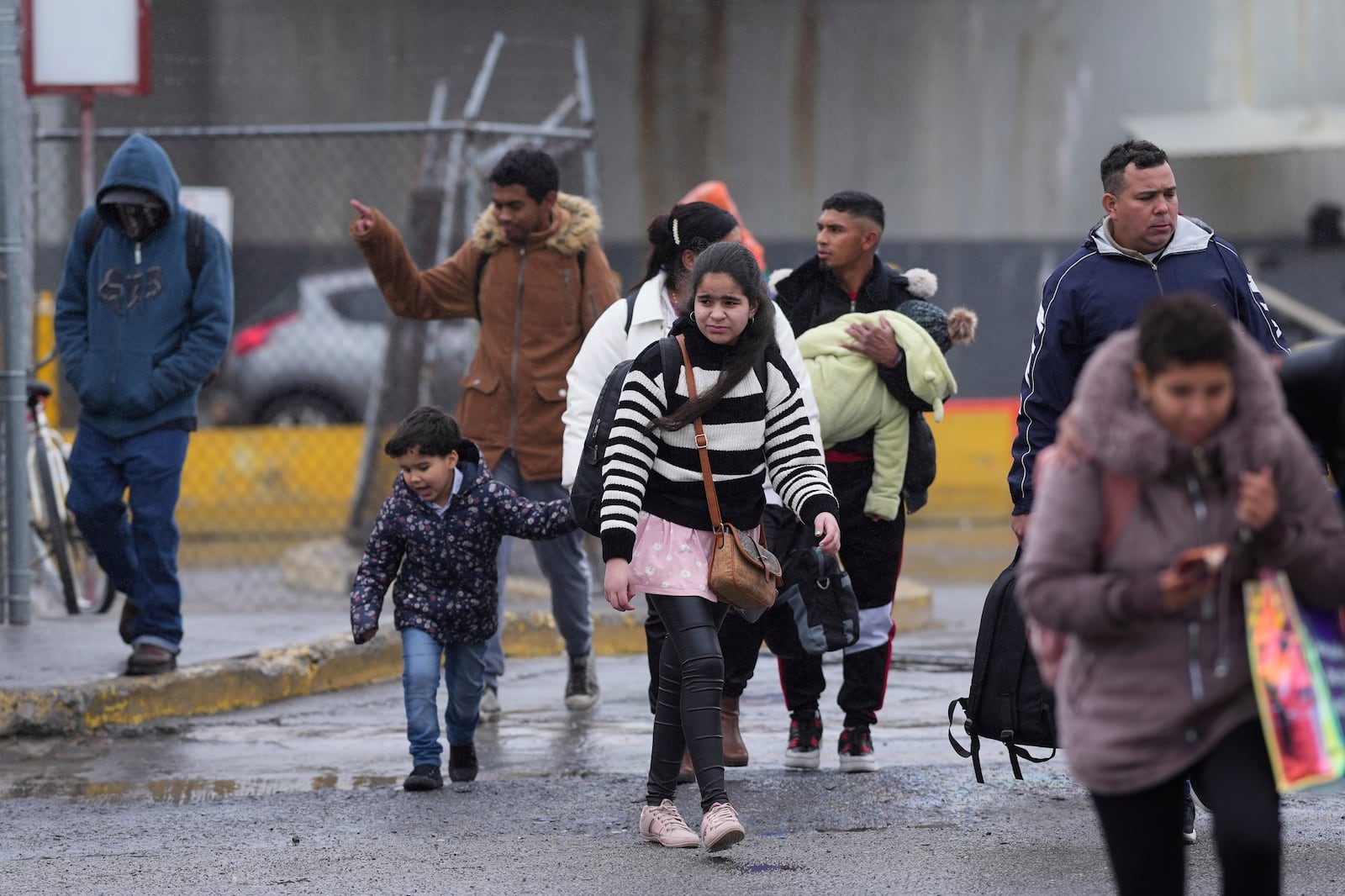 Migrants seeking asylum leave an immigration office after their scheduled meetings were canceled and they were turned away soon after President Donald Trump canceled the CBP One app, Monday, Jan. 20, 2025, in Matamoros, Mexico. (AP Photo/Eric Gay)