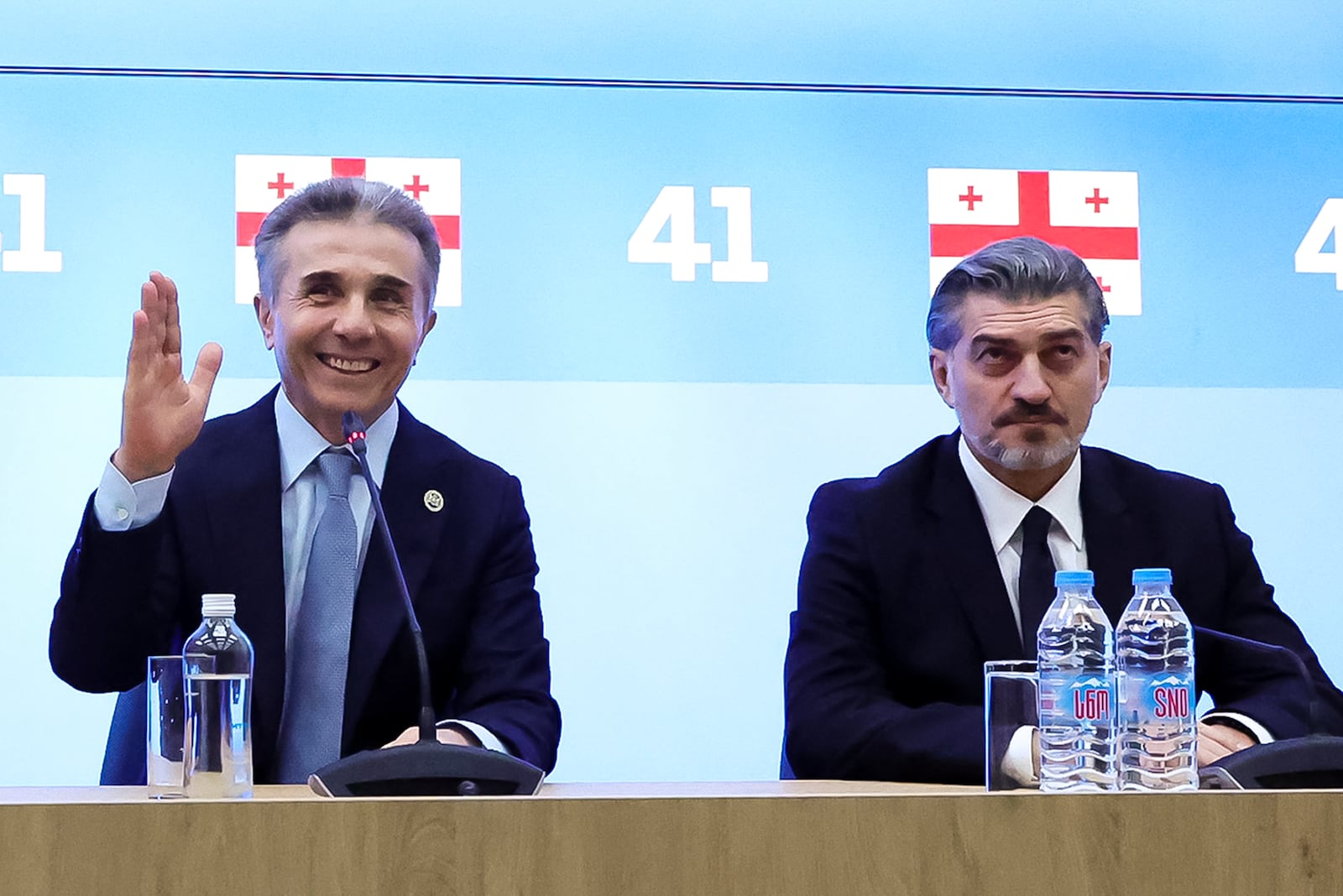 In this photo released by the Georgian Dream party, Bidzina Ivanishvili, leader of the created Georgian Dream party which he initiated, left, gestures as Mikheil Kavelashvili, who was nominated by the governing Georgian Dream party, sits next during a session to discussing Presidential candidate in Tbilisi, Georgia, Wednesday, Nov. 27, 2024. (Georgian Dream party via AP)