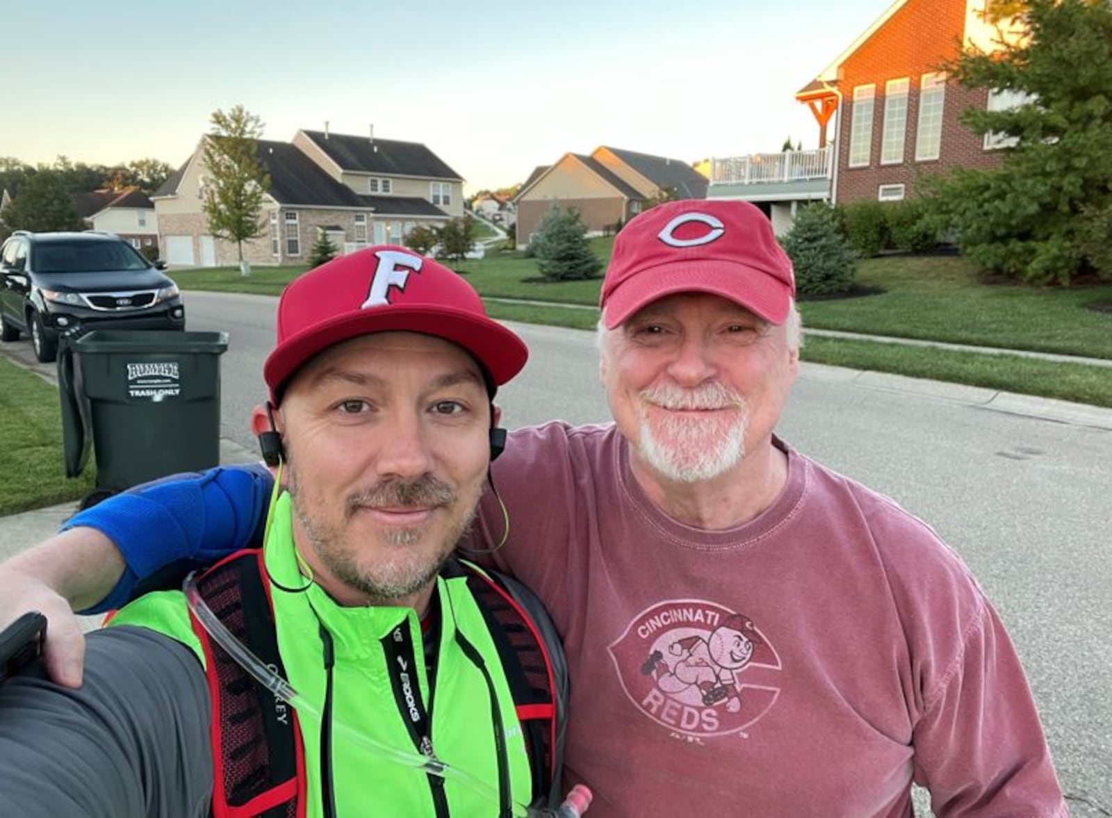 Ben Otto, left, of Fairfield, walked from his Fairfield home to the Reds game Friday night. His high school wrestling coach and friend, Jim Corwin, showed up to cheer him on. SUBMITTED PHOTO