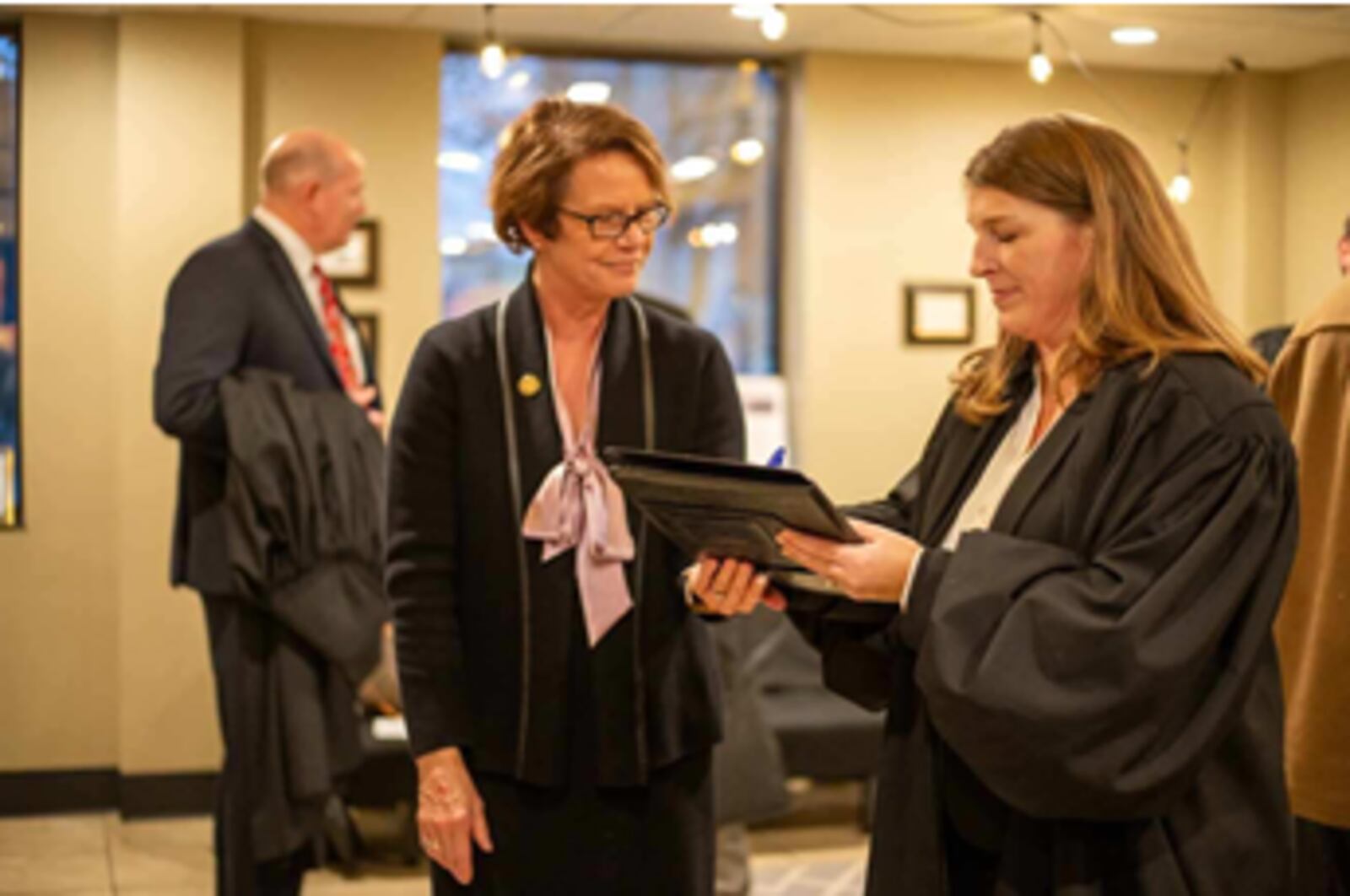 Kelly Heile was sworn in Friday, becoming the third woman to take the bench in the county common general division. Ohio Supreme Court Chief Justice Sharon Kennedy (right) swore Heile in. She will begin hearing cases on Jan. 2 in the courtroom occupied by  longtime Judge Noah Powers II since 2007. Powers has retired. ALEX JOHNSON/SUBMITTED