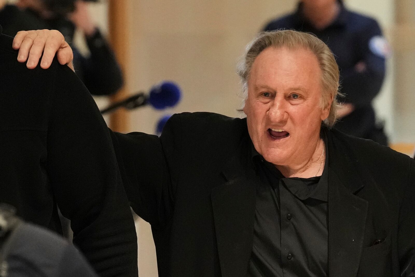 Actor Gerard Depardieu leaves the courtroom for a break during his trial for the alleged sexual assaults of two women on a film set in 2021, Tuesday, March 25, 2025 in Paris. (AP Photo/Aurelien Morissard)