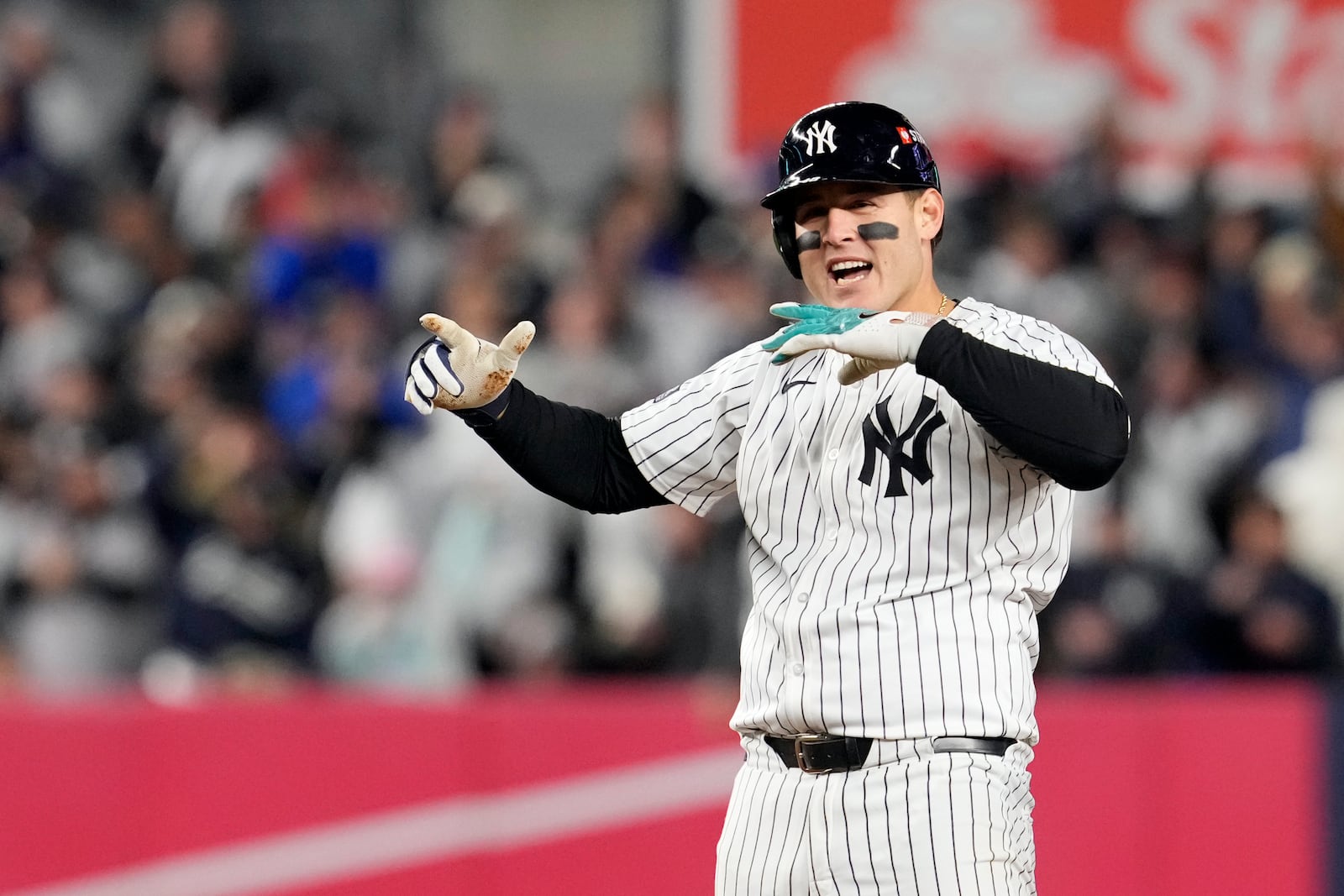 New York Yankees' Anthony Rizzo celebrates after hitting a RBI double against the Cleveland Guardians during the sixth inning in Game 2 of the baseball AL Championship Series Tuesday, Oct. 15, 2024, in New York. (AP Photo/Godofredo Vásquez)