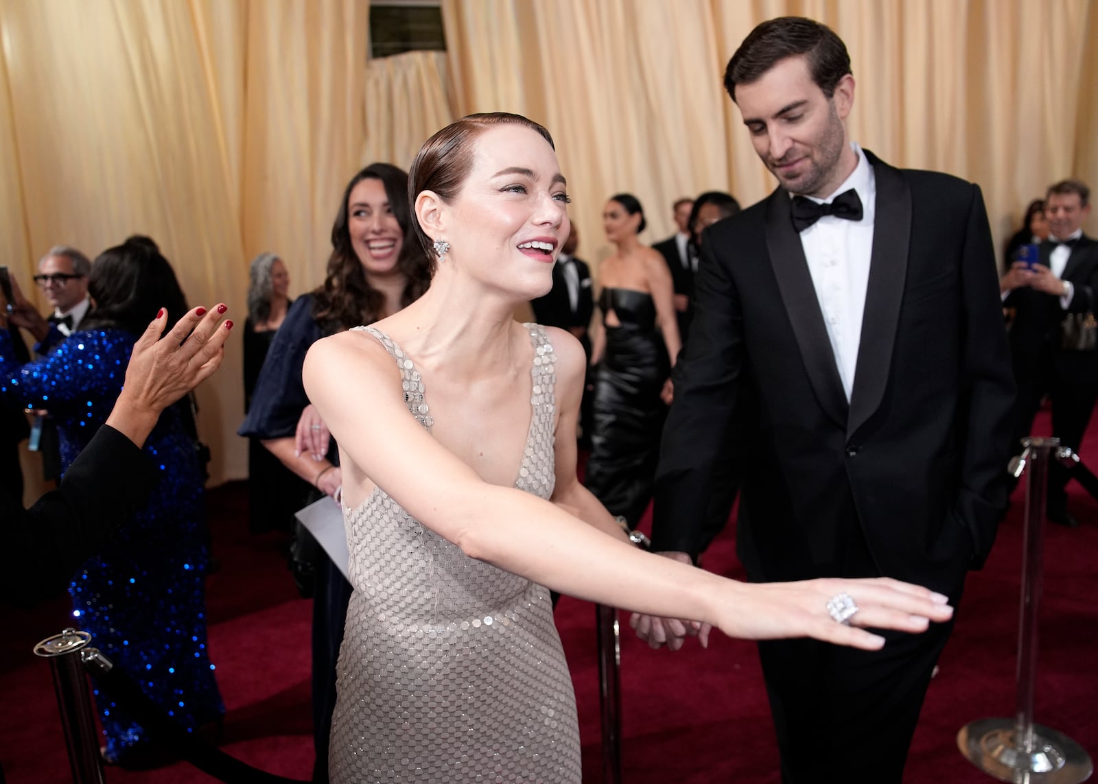 Emma Stone, left, and Dave McCary arrive at the Oscars on Sunday, March 2, 2025, at the Dolby Theatre in Los Angeles. (AP Photo/John Locher)